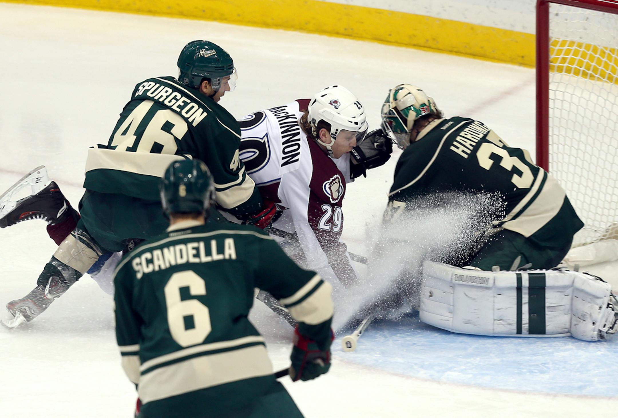 Marco Scandella (6) watches as the Wild's Jared Surgeon (46) tries to prevent Nathan MacKinnon (29) of the Colorado Avalanche from running into goaltender Josh Harding (37) of the Wild in the third period at Xcel Energy Center in St. Paul, MN on November 29, 2013. The Colorado Avalanche beat the Minnesota Wild by the score of 3-1. ] JOELKOYAMA‚Ä¢jkoyama@startribune Minnesota Wild vs Colorado Avalanche