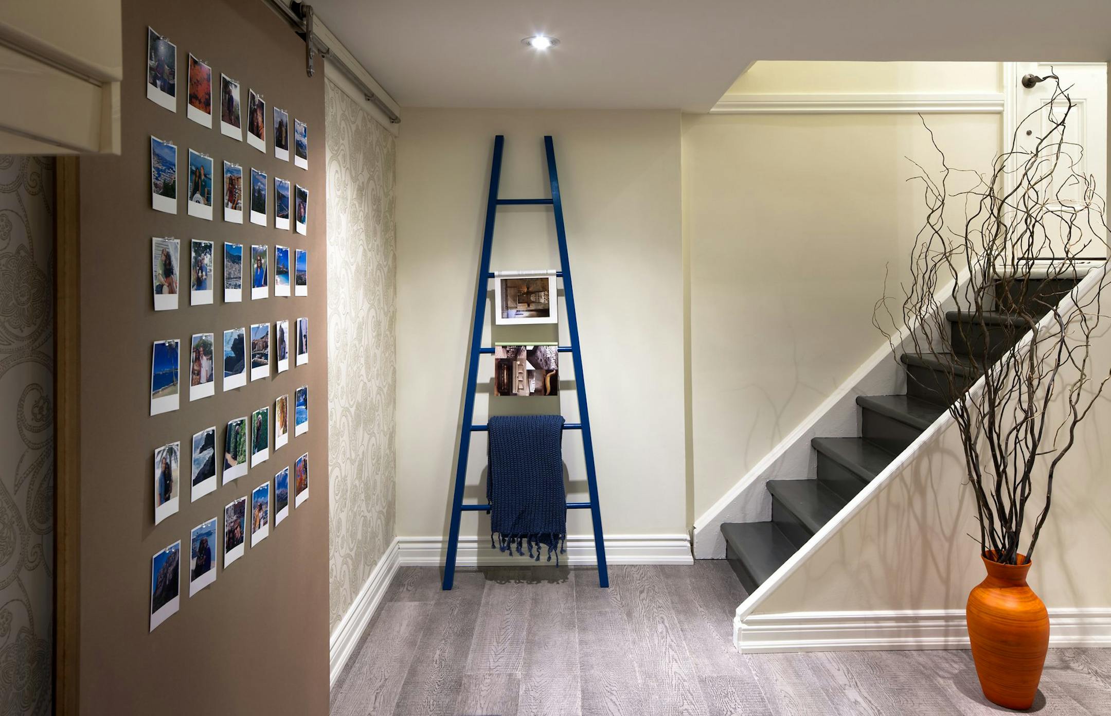 An innovative sliding door was installed to hide the storage room, with a useful pinboard surface, featuring the couple's travel photos. (Brandon Barre/MCT) ORG XMIT: 1153055