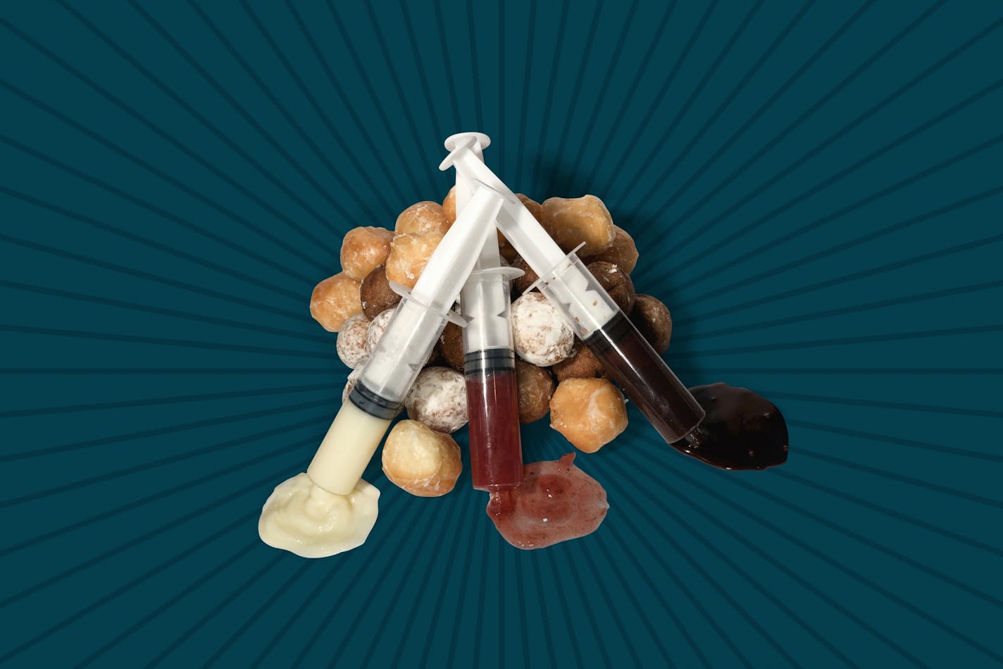 Wingwalker Donut Flight: An assortment of hot, deep-fried cake donut holes and three syringes with DIY fillings Ð Bavarian cream, chocolate custard and Minnesota lingonberry jam.