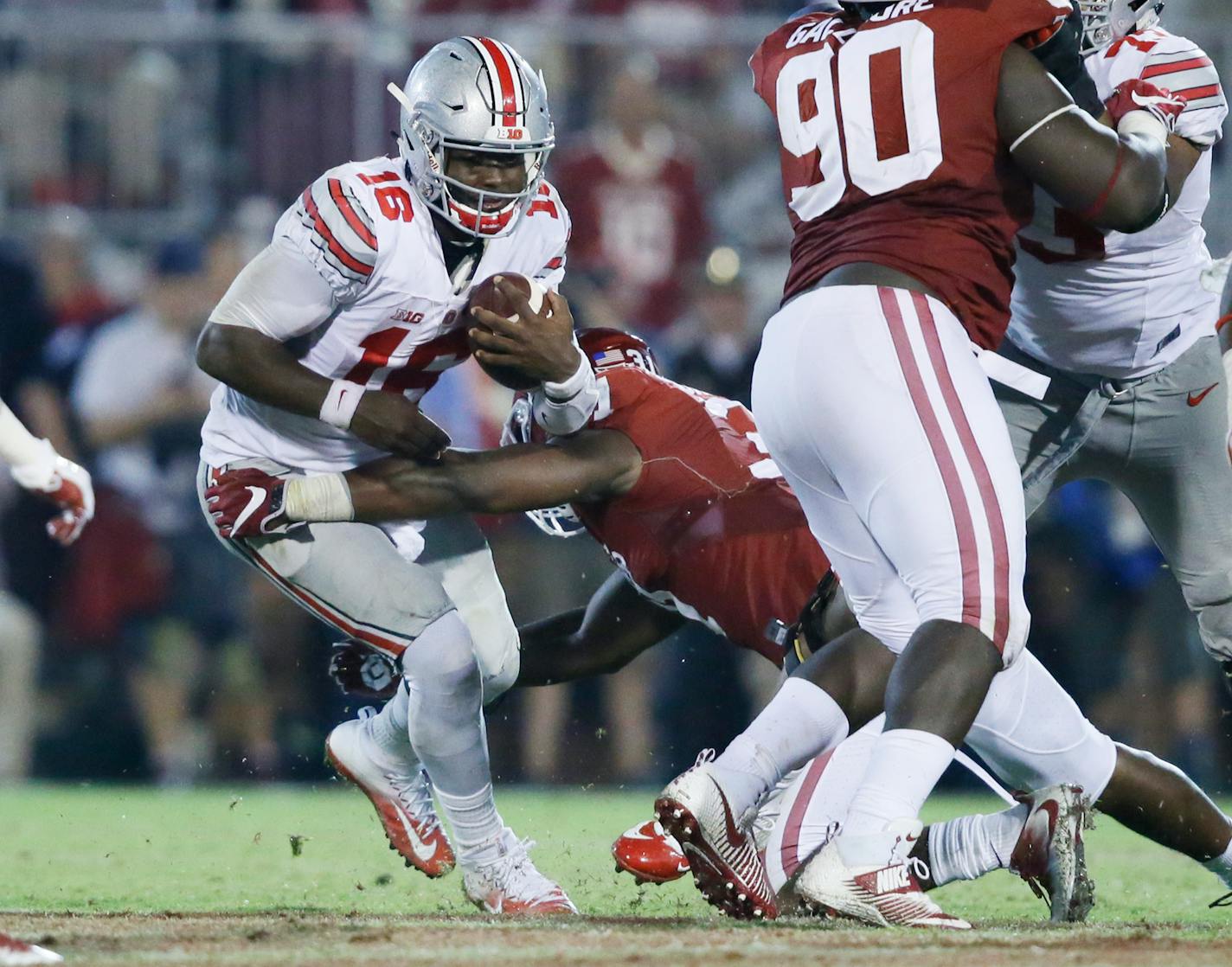 Ohio State quarterback J.T. Barrett (16) carries during the fourth quarter of an NCAA college football game against Oklahoma in Norman, Okla., Saturday, Sept. 17, 2016. Ohio State won 45-24. (AP Photo/Sue Ogrocki)