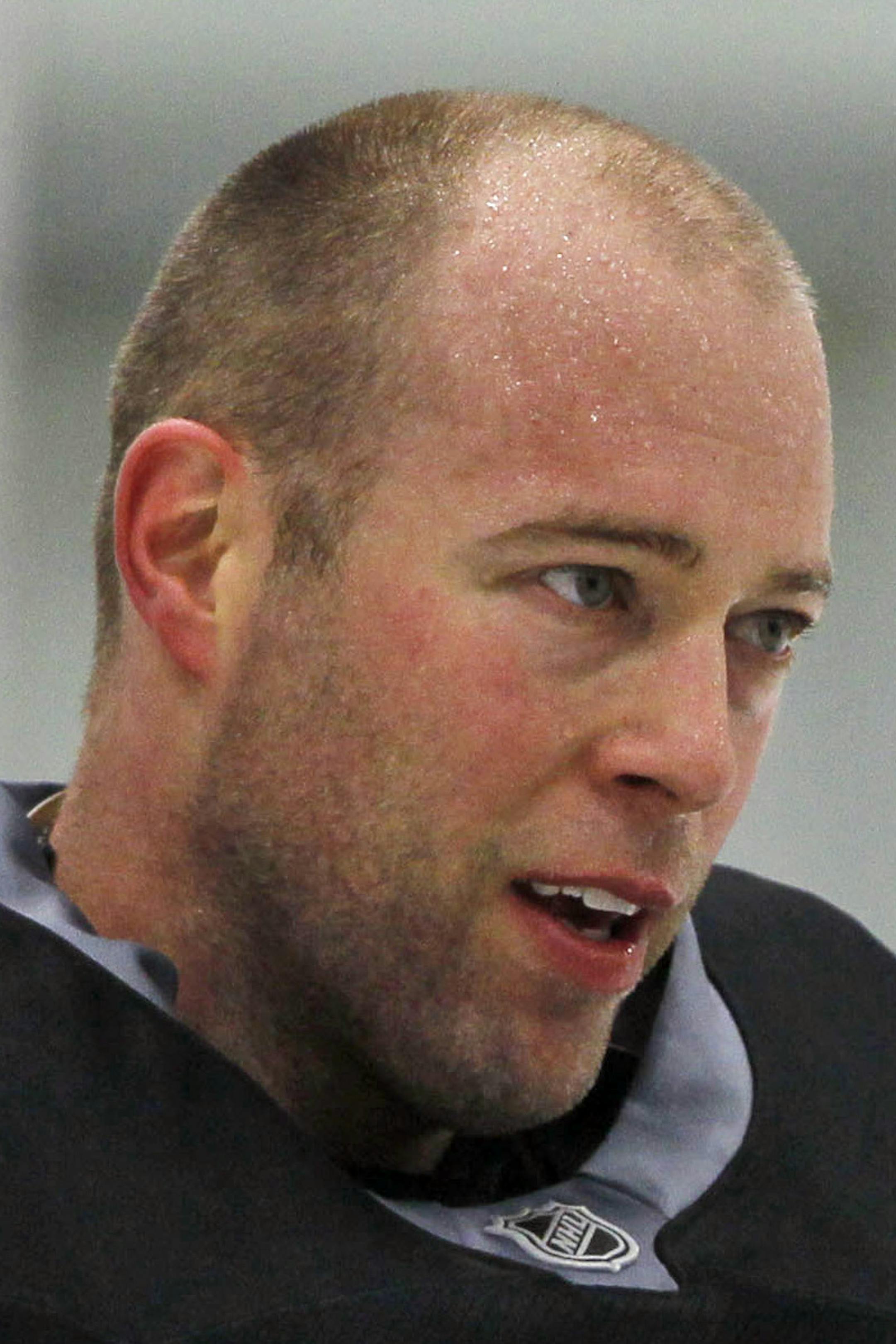 Colorado Avalanche goalies Jean-Sebastien Giguere, left, and Semyon Varlamov, of Russia, confer during the teams NHL hockey practice session in Englewood, Colo., on Monday, Jan. 14, 2013. (AP Photo/David Zalubowski) ORG XMIT: CODZ109