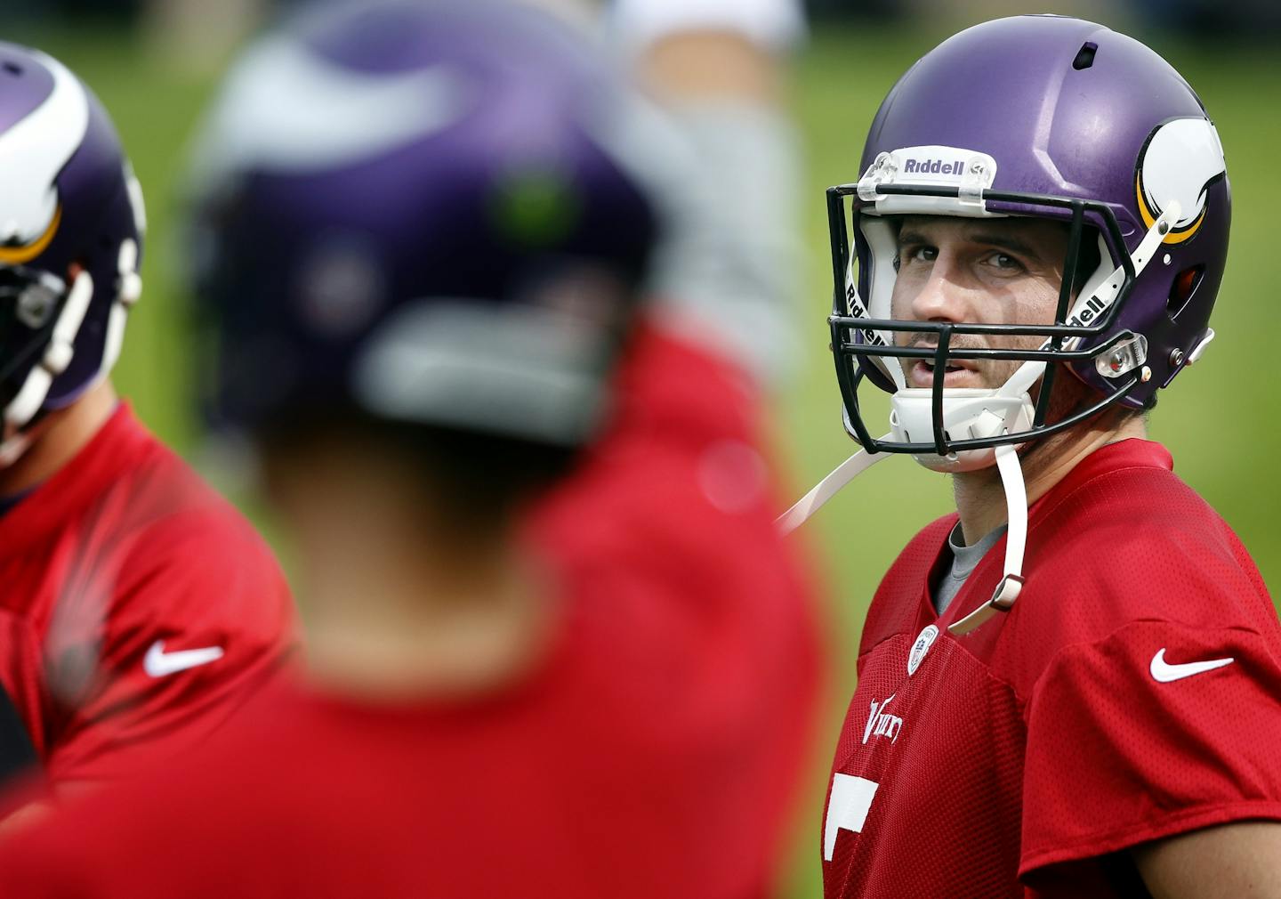 Minnesota Vikings quarterback Christian Ponder (7) watched Matt Cassel (16) throw pass during practice on Wednesday at The Grove in Watford, England.