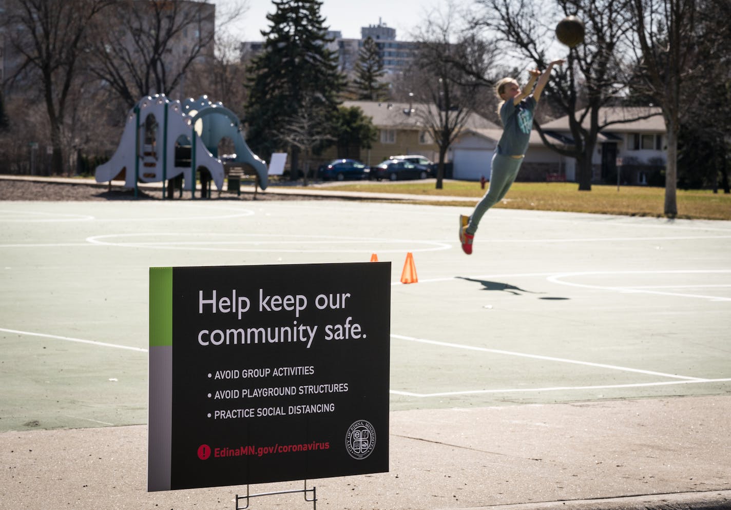 A sign encouraging social distancing at Strachauer Park in Edina. Edina city officials issued a warning to residents this weekend that large gatherings not practicing social distance could be ticketed.