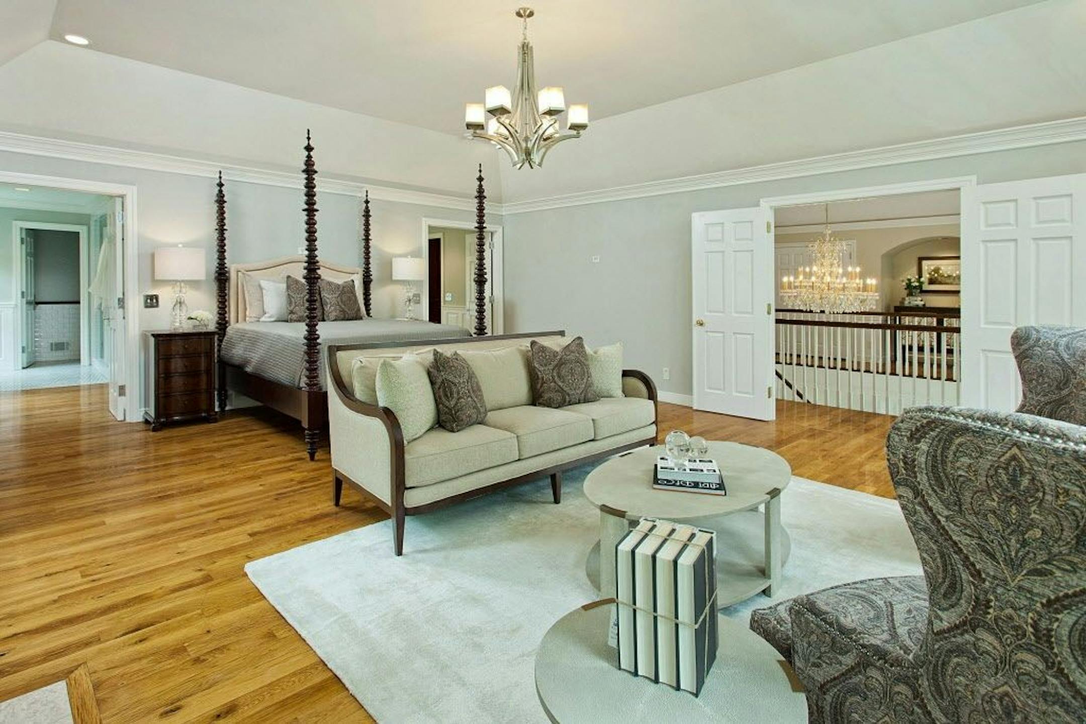 Master bedroom with sitting area and woodburning fireplace.