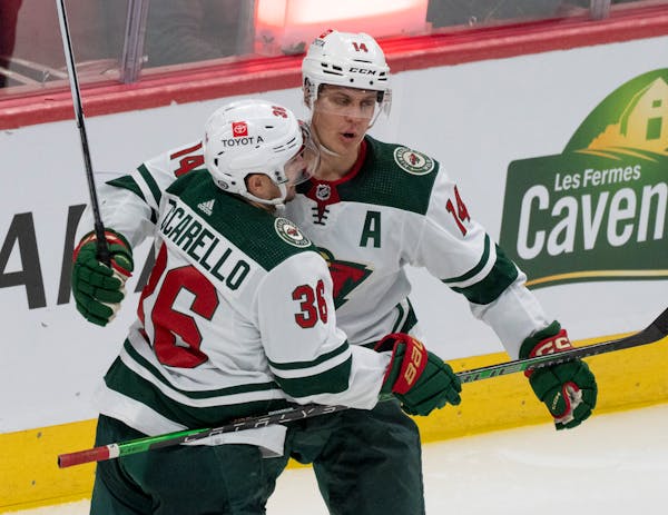 The Wild’s Joel Eriksson Ek (14) celebrated his goal over the Canadiens with teammate Mats Zuccarello (36) during the second period Tuesday in Montr