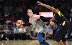 Lynx Lindsay Whalen passed the ball around Fever Kelsey Mitchell at Target Center Tuesday July 3, 2018 in Minneapolis, MN.