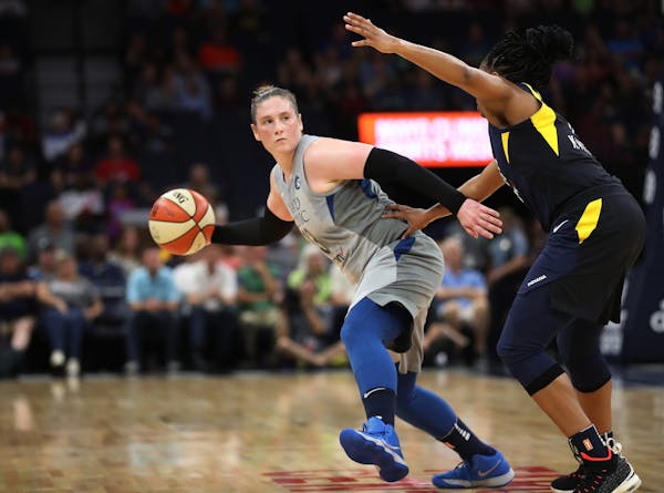 Lynx Lindsay Whalen passed the ball around Fever Kelsey Mitchell at Target Center Tuesday July 3, 2018 in Minneapolis, MN.