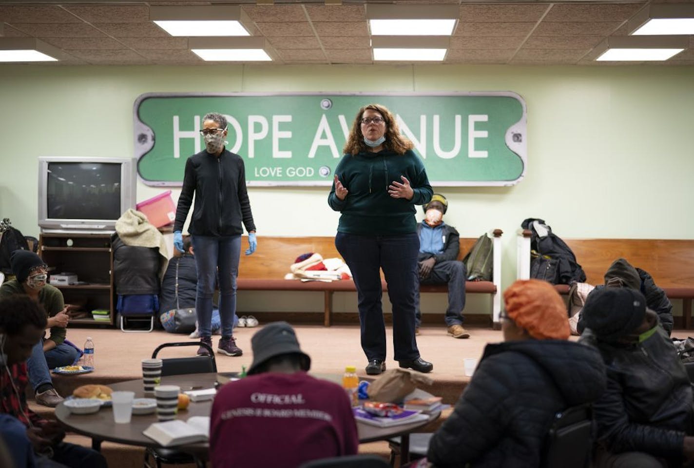 Hope Avenue program director Monica Nilsson gave information about how clients of the shelter can help safeguard themselves from the coronavirus before Dr. Julia Joseph-Di Caprio, left, gave more medical information and answered questions from the clients.