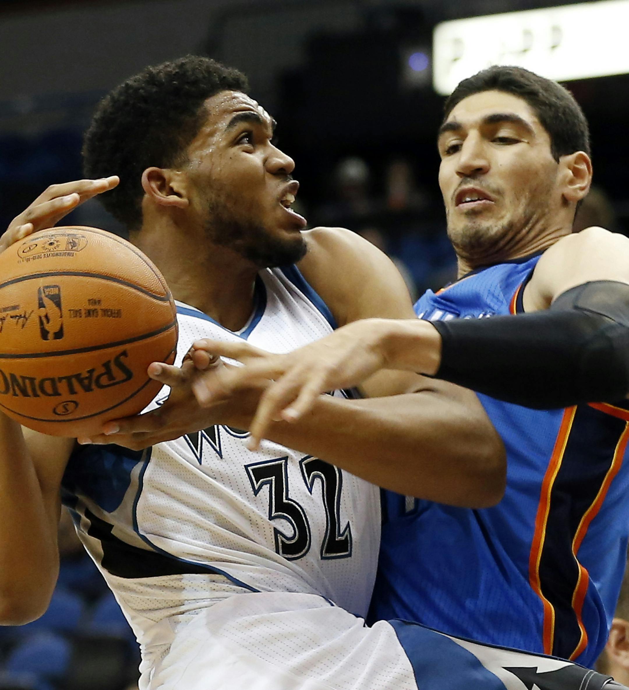 Minnesota Timberwolves’ Karl-Anthony Towns, left, is fouled by Oklahoma City Thunder’ Enes Kanter of Turkey in the first half of a preseason NBA basketball game, Wednesday, Oct. 7, 2015, in Minneapolis. Towns was the overall first round draft pick.(AP Photo/Jim Mone)