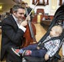 Cello player Richard Belcher plays for his 14-month-old son Finn before performing int he concert. ] LEILA NAVIDI &#xef; leila.navidi@startribune.com 