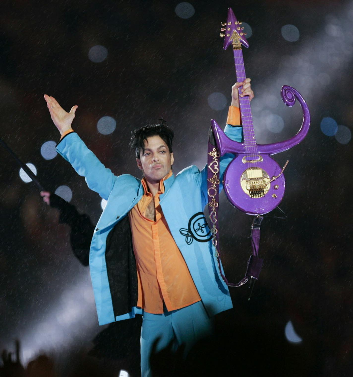 FILE - In this Feb. 4, 2007 file photo, Prince performs during halftime of the Super Bowl XLI football game in Miami. Three heirs of Prince are asking a judge to remove the company that is managing his estate. The late music superstar's half siblings Sharon, Norrine and John R. Nelson filed a motion Friday, Oct. 27, 2017, to remove Comerica Bank and Trust as estate executor. The three are upset that Comerica removed the contents of Prince's vault, including master tapes of unreleased music, from