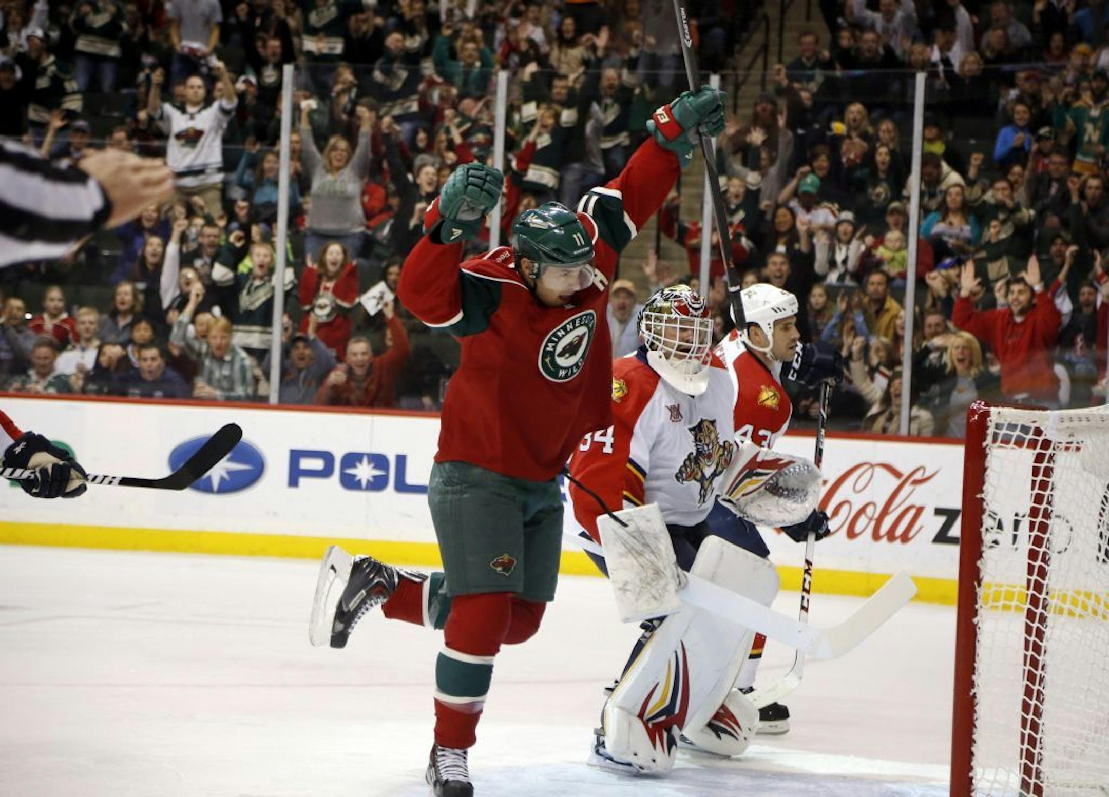 During the first period, the Minnesota Wild's Zach Parise (11) celebrates the game's first goal, past Florida goallie Tim Thomas (34) at the Xcel Energy Center Friday, Nov. 15, 2013, in St. Paul, MN.
