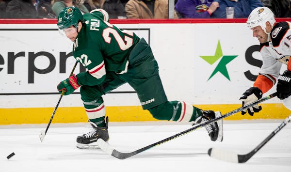 Kevin Fiala (22) of the Minnesota Wild skated with puck in the second period.