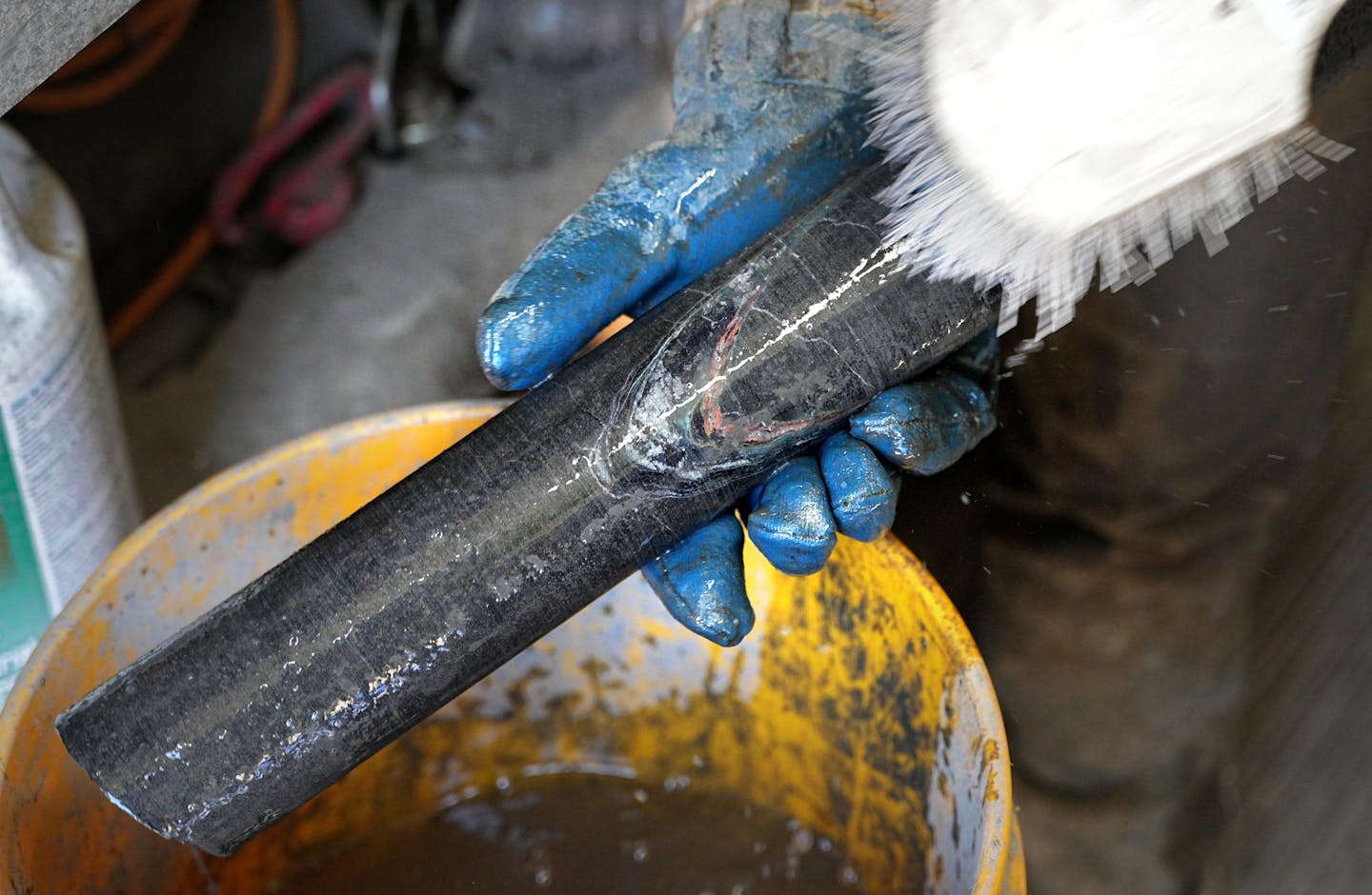 A worker shows a core sample, in search of nickel, at Talon Metals' proposed Tamarack Mine.