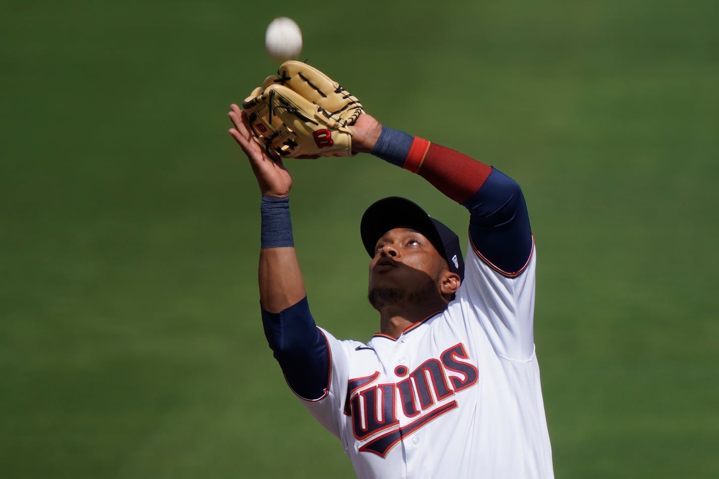 Minnesota Twins shortstop Jorge Polanco catches a fly ball in the second inning during a spring training baseball game against the Boston Red Sox on Sunday, Feb. 28, 2021, in Fort Myers, Fla. (AP Photo/Brynn Anderson)