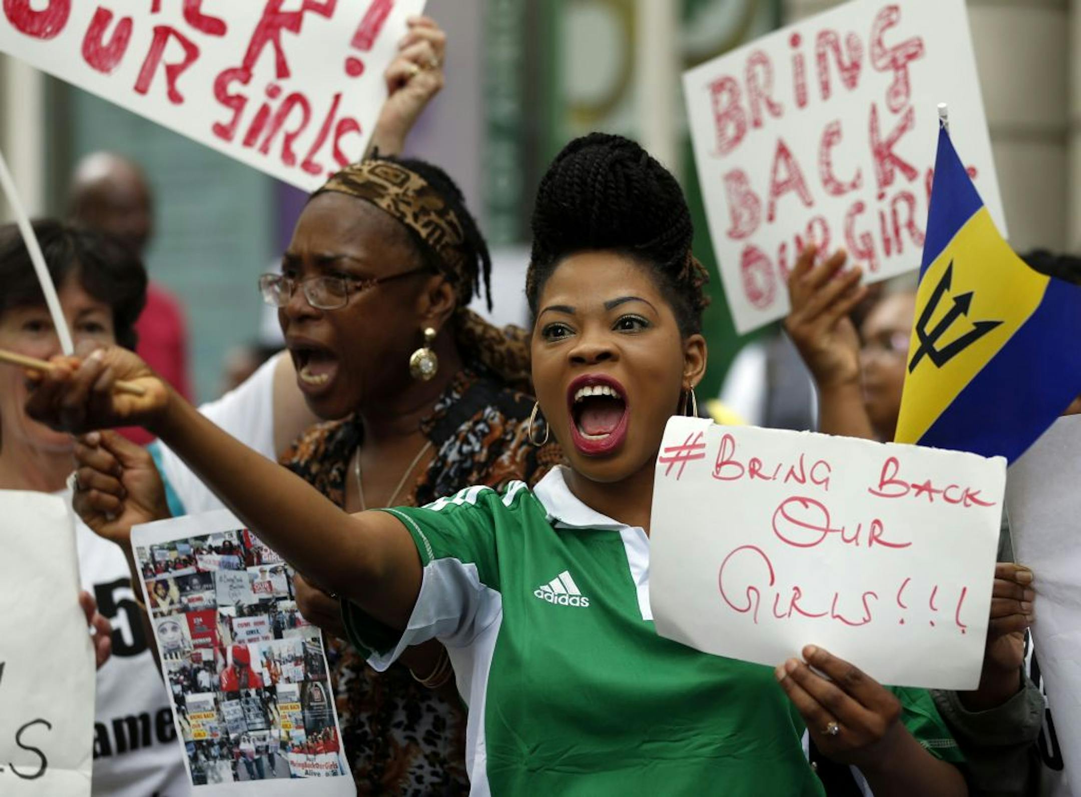 Participants in a march from the Nigerian High Commission to Downing Street in London, Saturday, May 17, 2014, as they call for the return of the schoolgirls who were kidnapped in Nigeria. Leaders from five African nations are gathering in Paris for a summit with officials from the U.S., France and Britain in hopes of coordinating a strategy against Boko Haram, the Islamic extremist group that abducted more than 300 Nigerian girls. (AP Photo / Jonathan Brady/PA) UNITED KINGDOM OUT - NO SALES - N