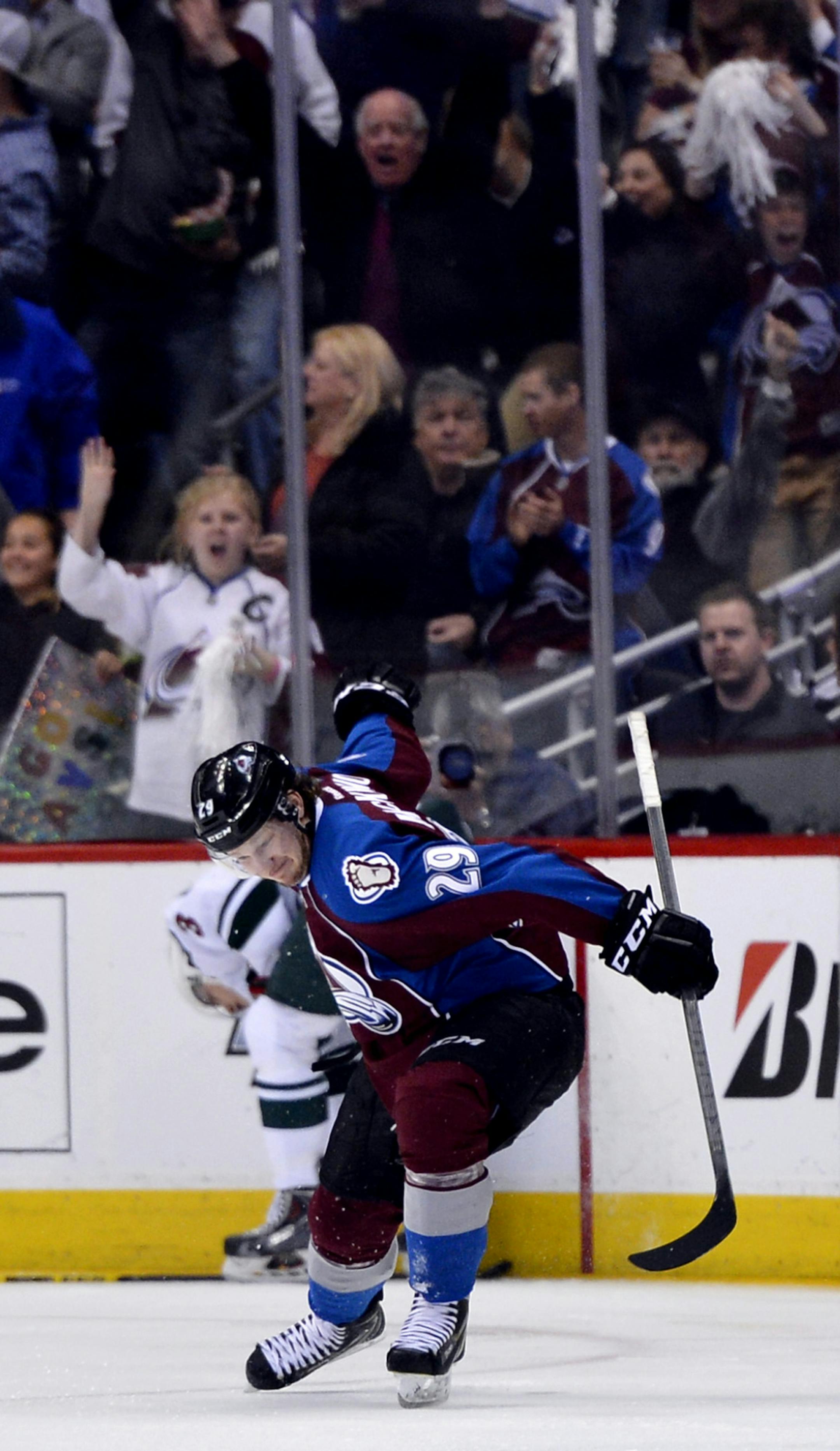 Colorado Avalanche center Nathan MacKinnon celebrates a goal against the Minnesota Wild in the first period of Game 2 of an NHL hockey first-round playoff series on Saturday, April 19, 2014, in Denver. (AP Photo/Jack Dempsey) ORG XMIT: OTK
