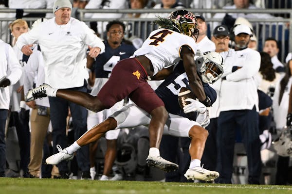 Penn State wide receiver Mitchell Tinsley caught a pass against Gophers cornerback Terell Smith during Minnesota’s 45-17 loss on Saturday.