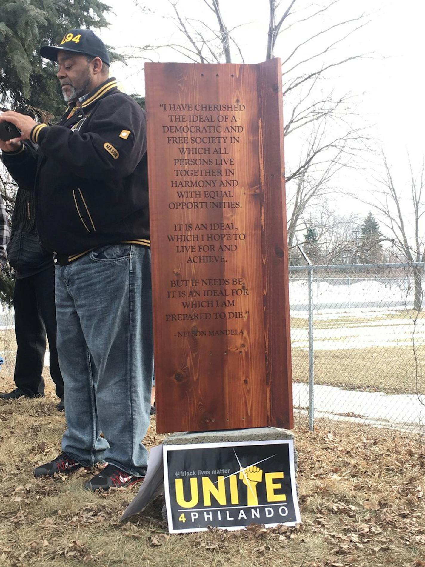 The polished wooden memorial for Philando Castile has a quote from Nelson Mandela carved into it.