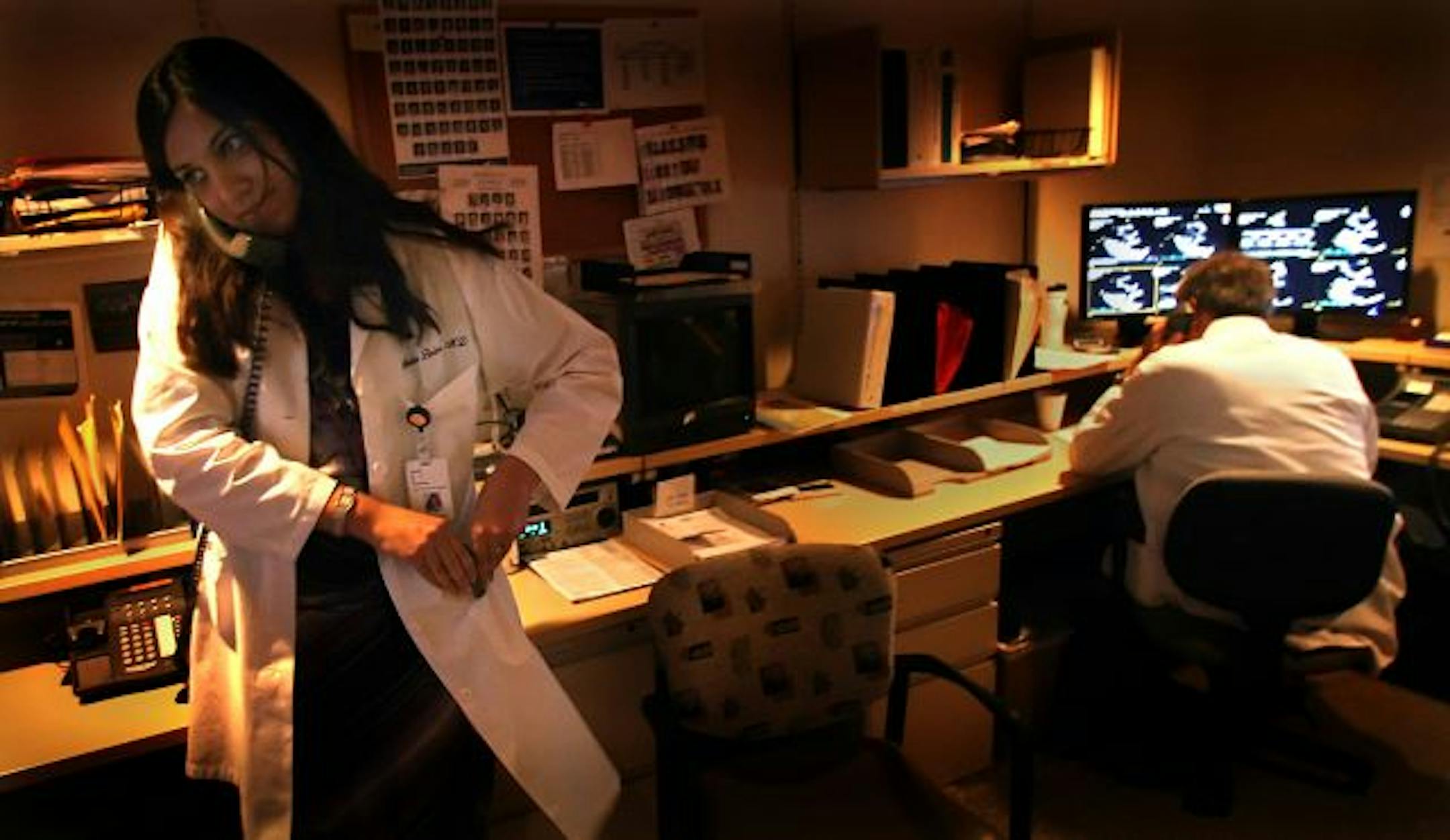 Dr. Shalini Bobra answered a call in the echocardiogram reading room at Abbott Northwestern Hospital in Minneapolis. Despite the demands of her profession, Bobra says she sees a need for women cardiologists, saying, "many women prefer to see women doctors."