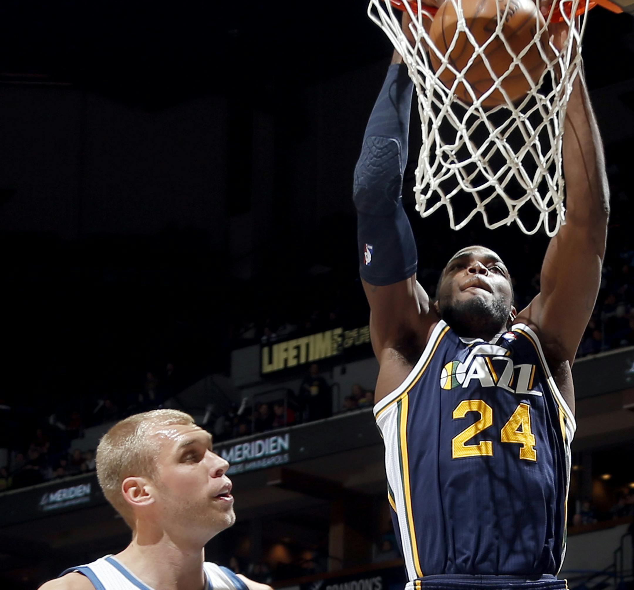 Paul Millsap (24) dunked the ball while being defended by Greg Stiemsma (34) in the first quarter. ] CARLOS GONZALEZ cgonzalez@startribune.com April 15, 2013, Minneapolis, Minn., Target Center, NBA, Minnesota Timberwolves vs. Utah Jazz