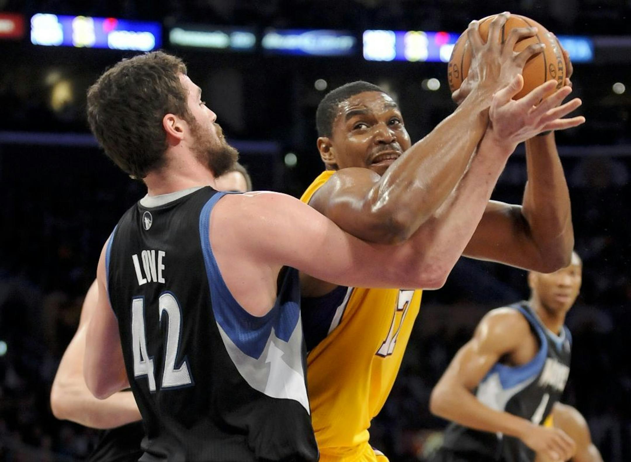 Los Angeles Lakers center Andrew Bynum (17) battles Minnesota Timberwolves forward Kevin Love (42) as he looks for a shot in the first half of an NBA basketball game, Friday, March, 16, 2012, in Los Angeles.