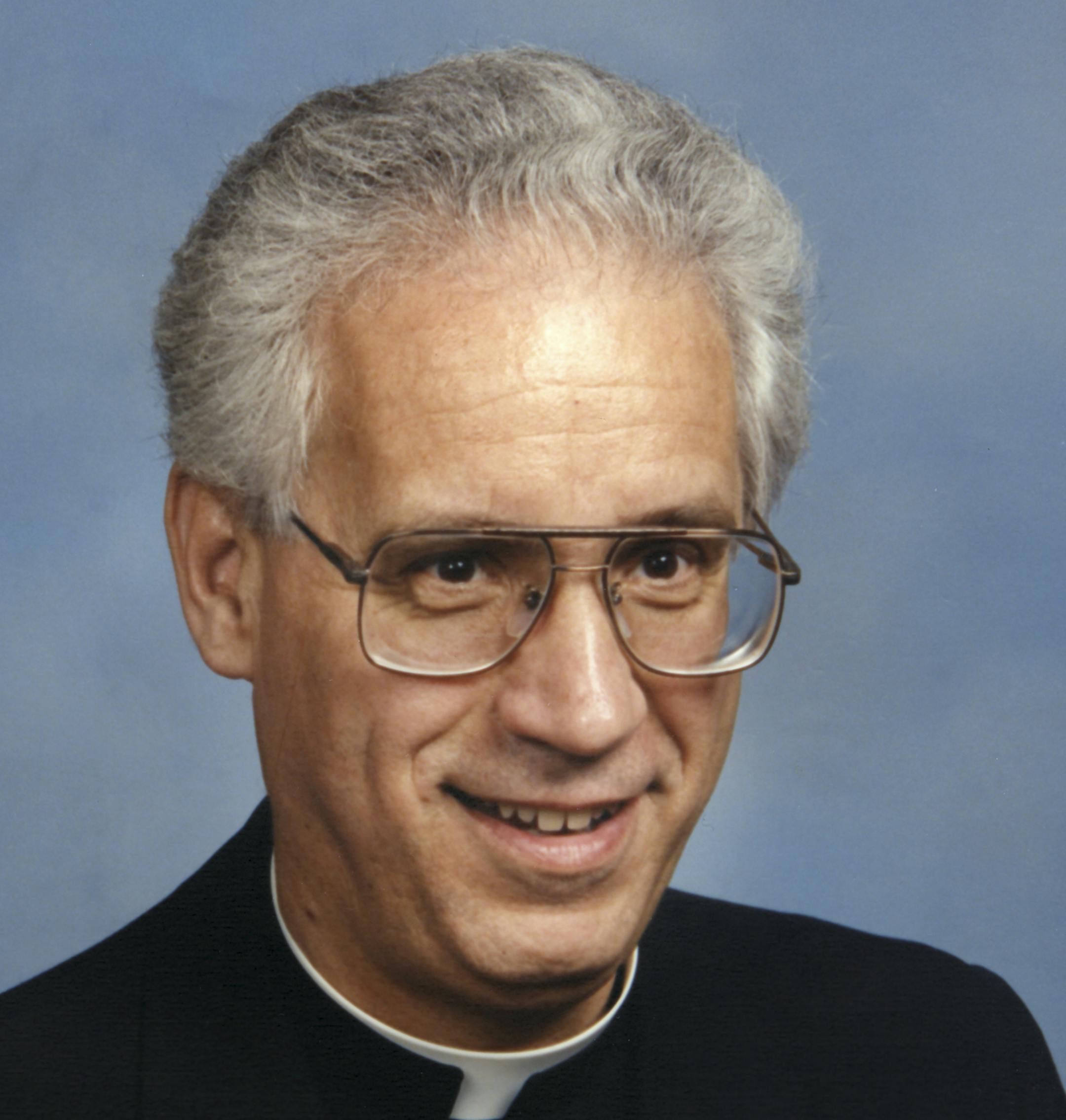 Father Charles Froehle who was a professor, dean and rector at the St. Paul Seminary School of Divinity. Scanned on January 13, 2015. Original print by Olan Mills Studio in 1989.