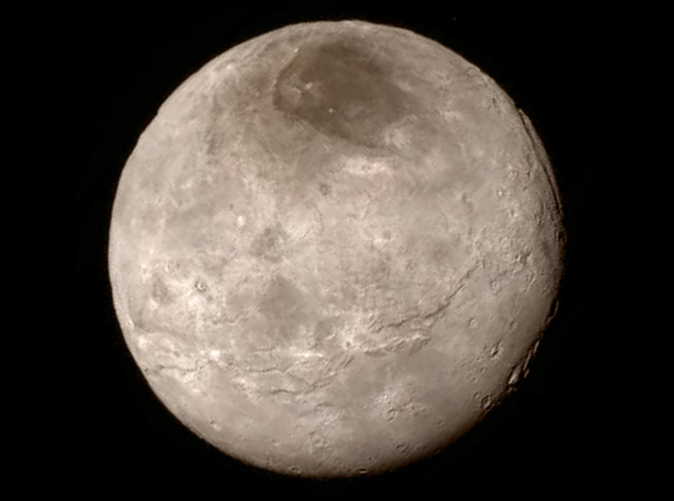 This image of Pluto's largest moon Charon was taken by the New Horizons spacecraft late on July 13, 2015, from a distance of 289,000 miles, or 466,000 kilometers. (NASA/JHU APL/SwRI)