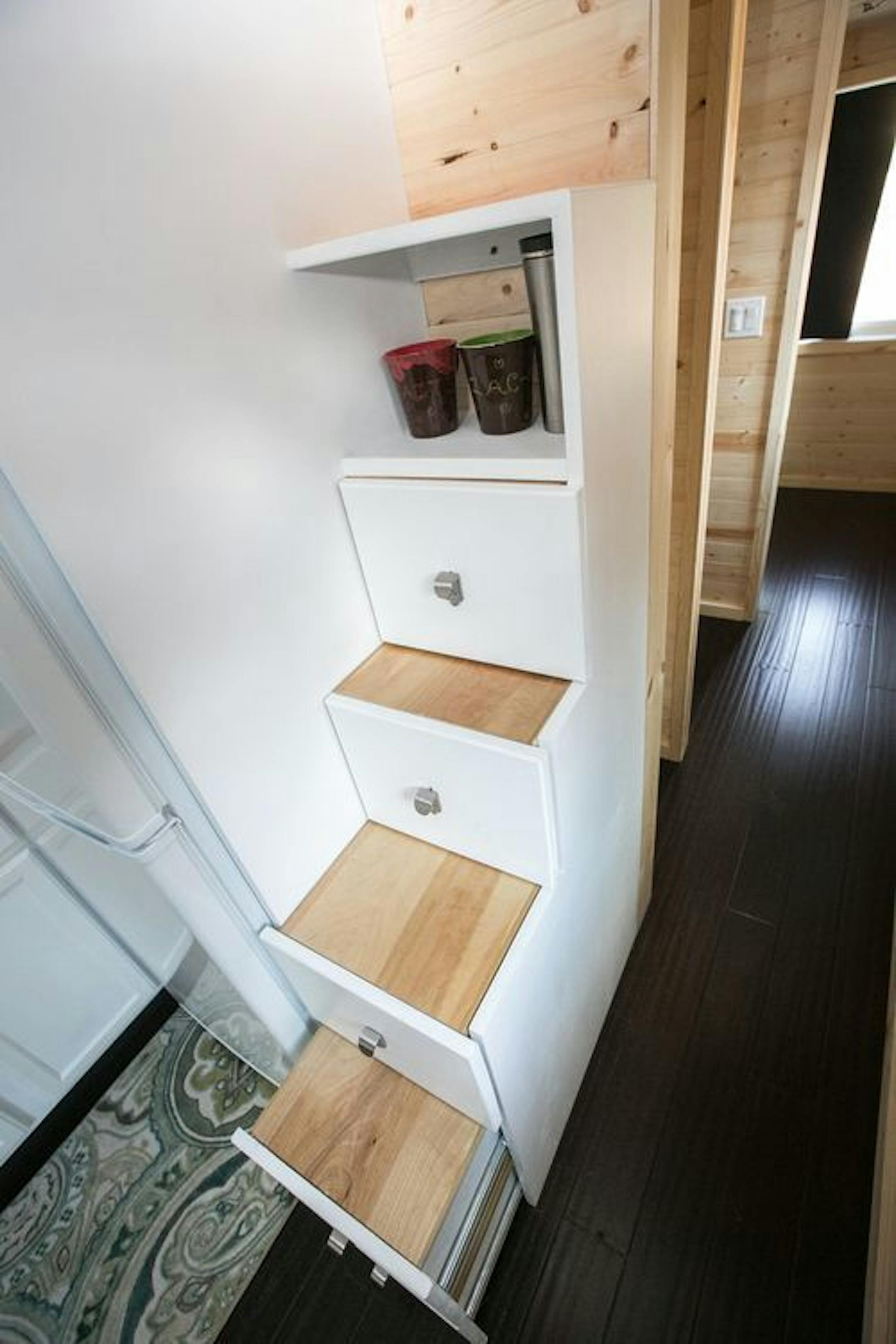 The pantry cupboards are engineered so they can be pulled out and used as steps to the loft.