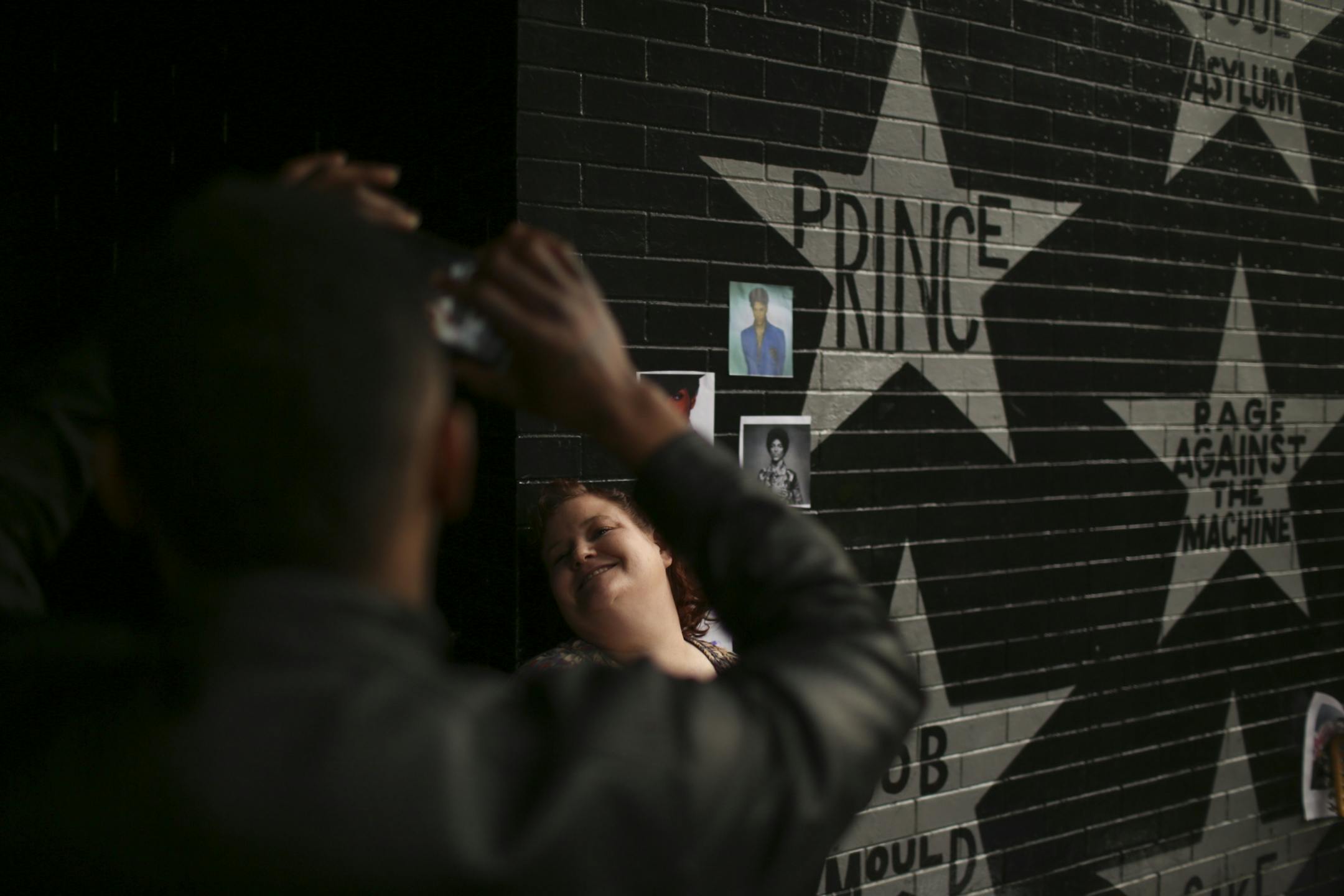 The growing memorial under Prince's star at First Ave. drew multitudes of fans throughout Tuesday afternoon and evening.