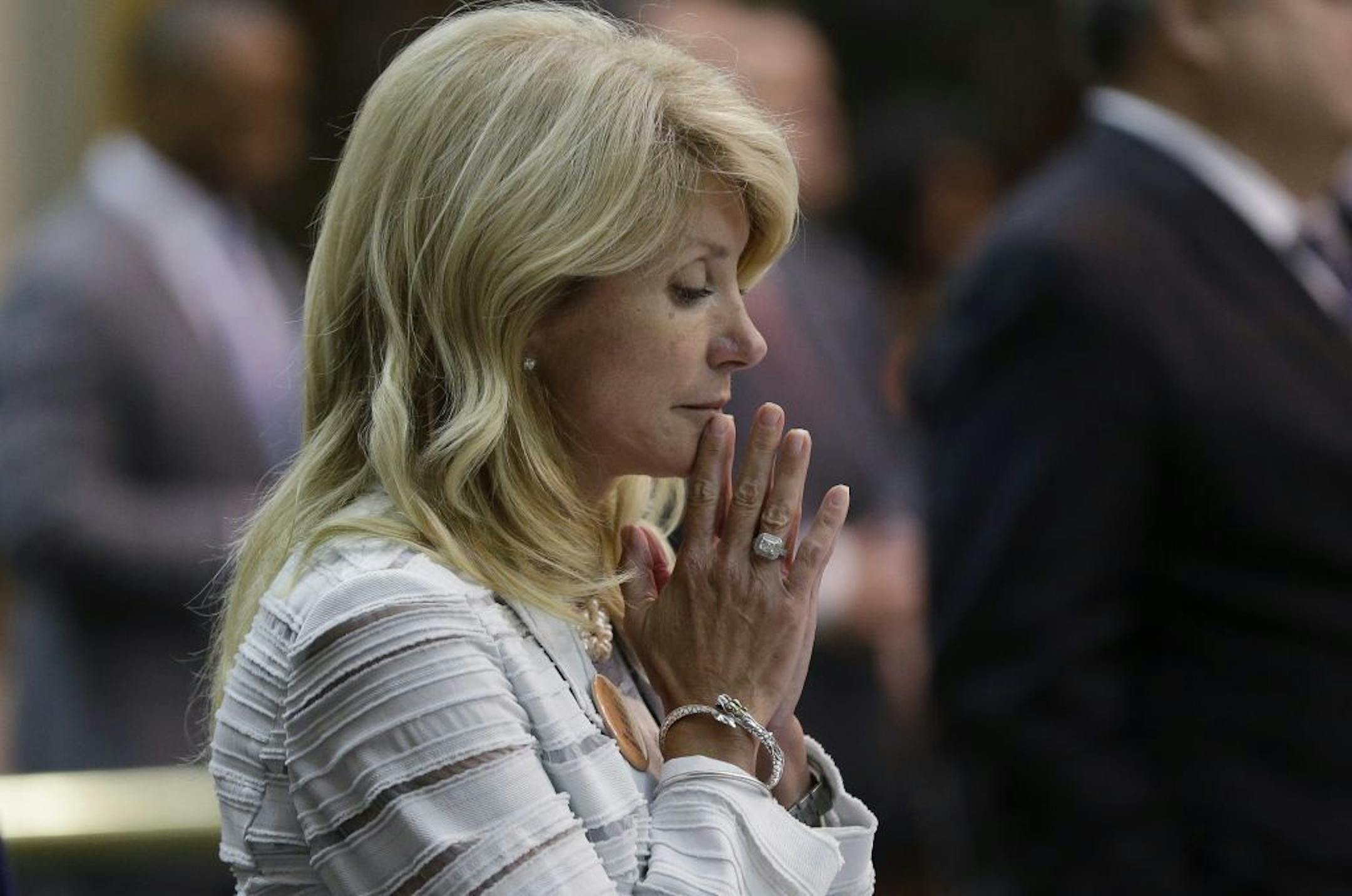 Sen. Wendy Davis, D-Fort Worth, reacts after she was called for a third and final violation in rules to end her filibuster attempt to kill an abortion bill, Tuesday, June 25, 2013, in Austin, Texas.
