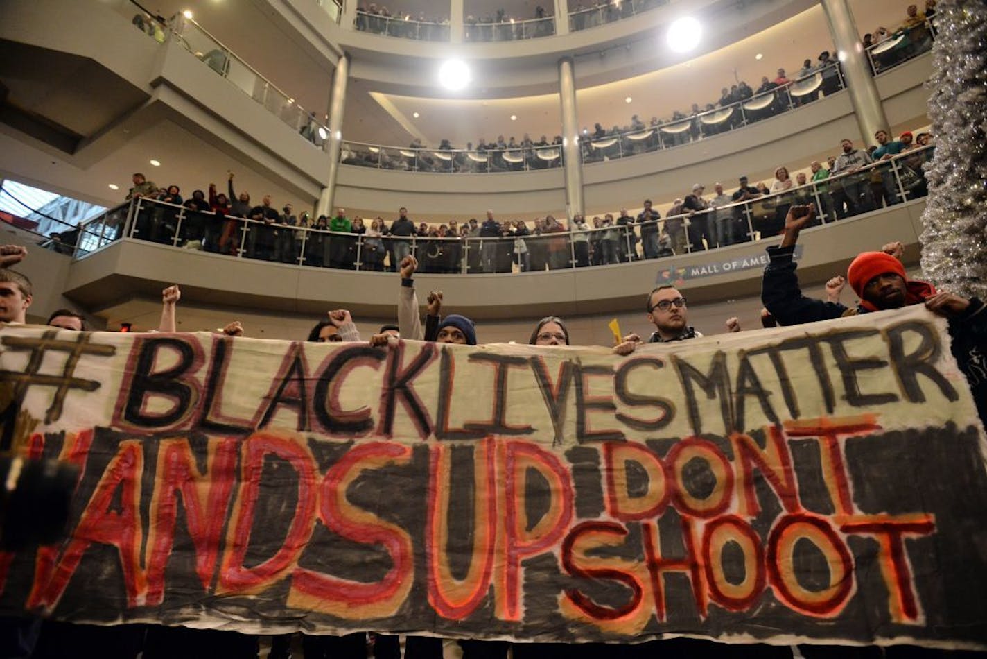 Demonstrators filled the Mall of America rotunda and chanted "Black lives matter" to protest police brutality, Saturday, Dec. 12, 2014, in Bloomington, Minn. The group Black Lives Matter Minneapolis had more than 3,000 people confirm on Facebook that they would attend. Attendance figures weren't immediately available. (AP Photo/The Star Tribune, Aaron Lavinsky) ORG XMIT: MIN2015011814105351