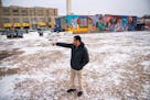 Faisal Demaag, owner of Chicago Furniture Warehouse, discusses the former layout of his store on the plot of land where it used to be Friday, Dec. 17,