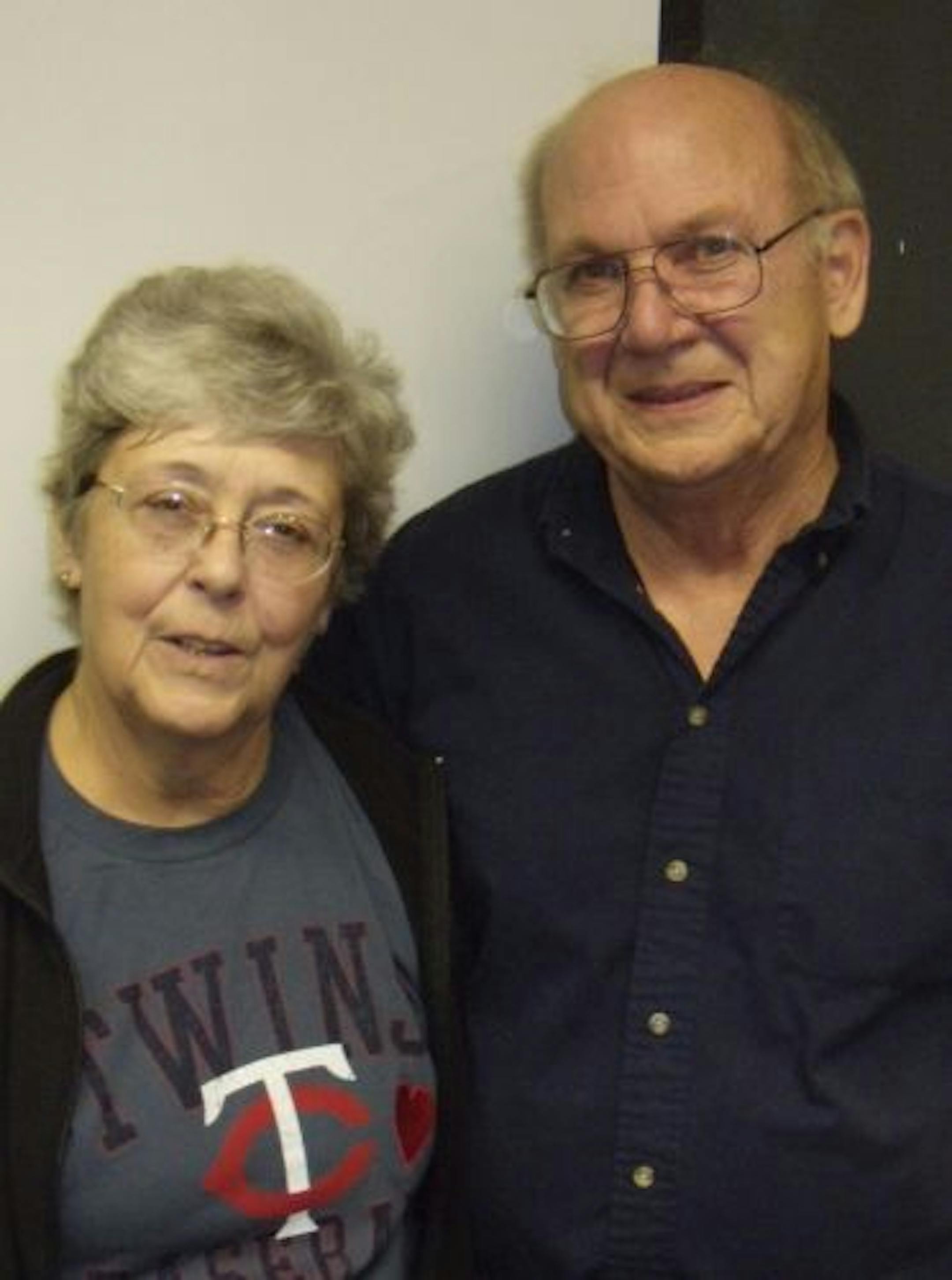 Pat Hall and her husband Bob posed for a photo Wednesday at a press conference at Hennepin County Medical Center where she thanked the first responders who administered CPR on her after she suffered cardiac arrest while at the Twins-Cleveland Indians game April 21. Pat Hall was wearing a Twins shirt with a heart on it and said "I have my Twins shirt with this heart, and I still have mine."