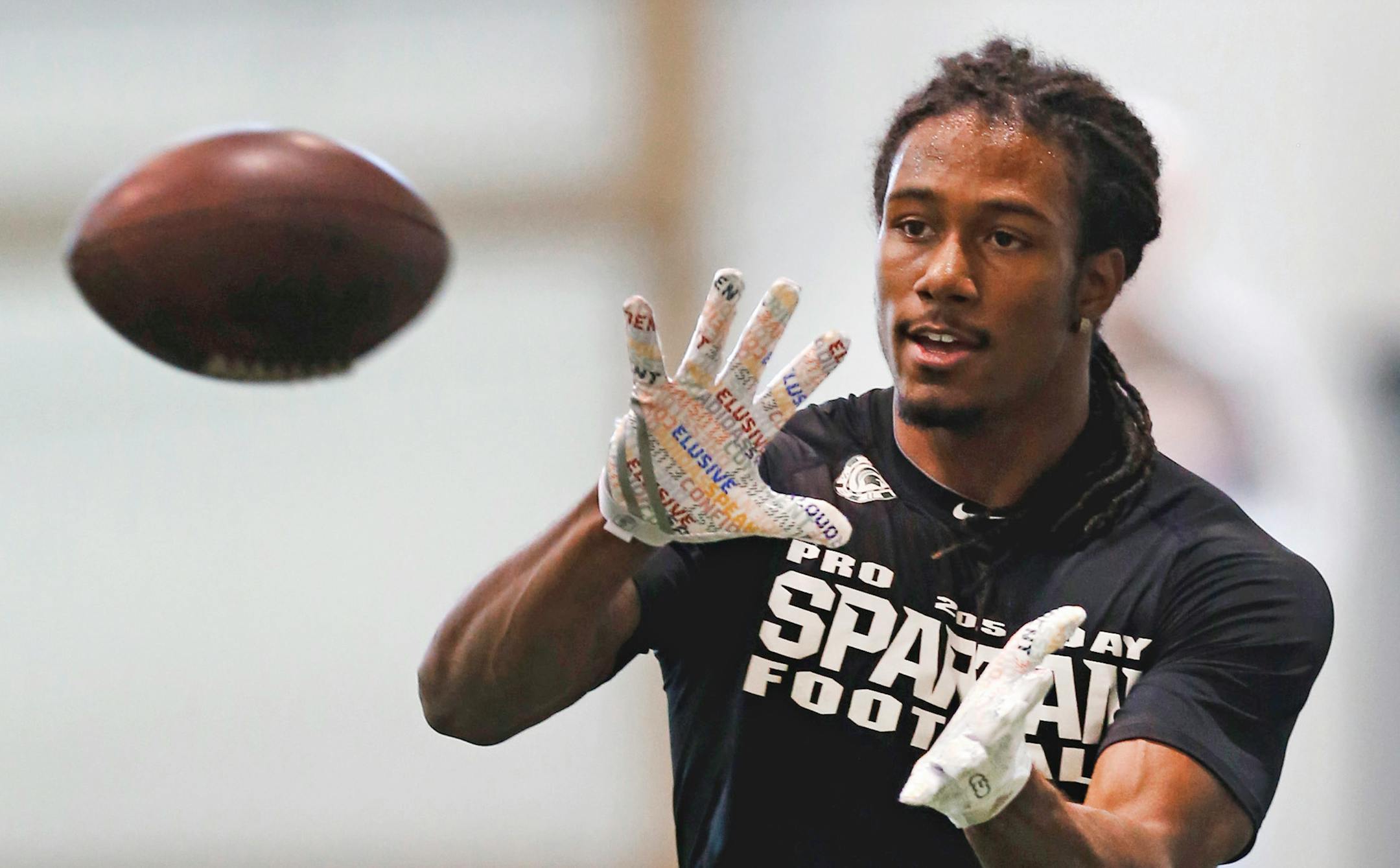 Cornerback Trae Waynes catches a ball during Michigan State NFL football pro day in East Lansing, Mich., Wednesday, March 18, 2015. (AP Photo/Paul Sancya) ORG XMIT: MIN2015042217280107