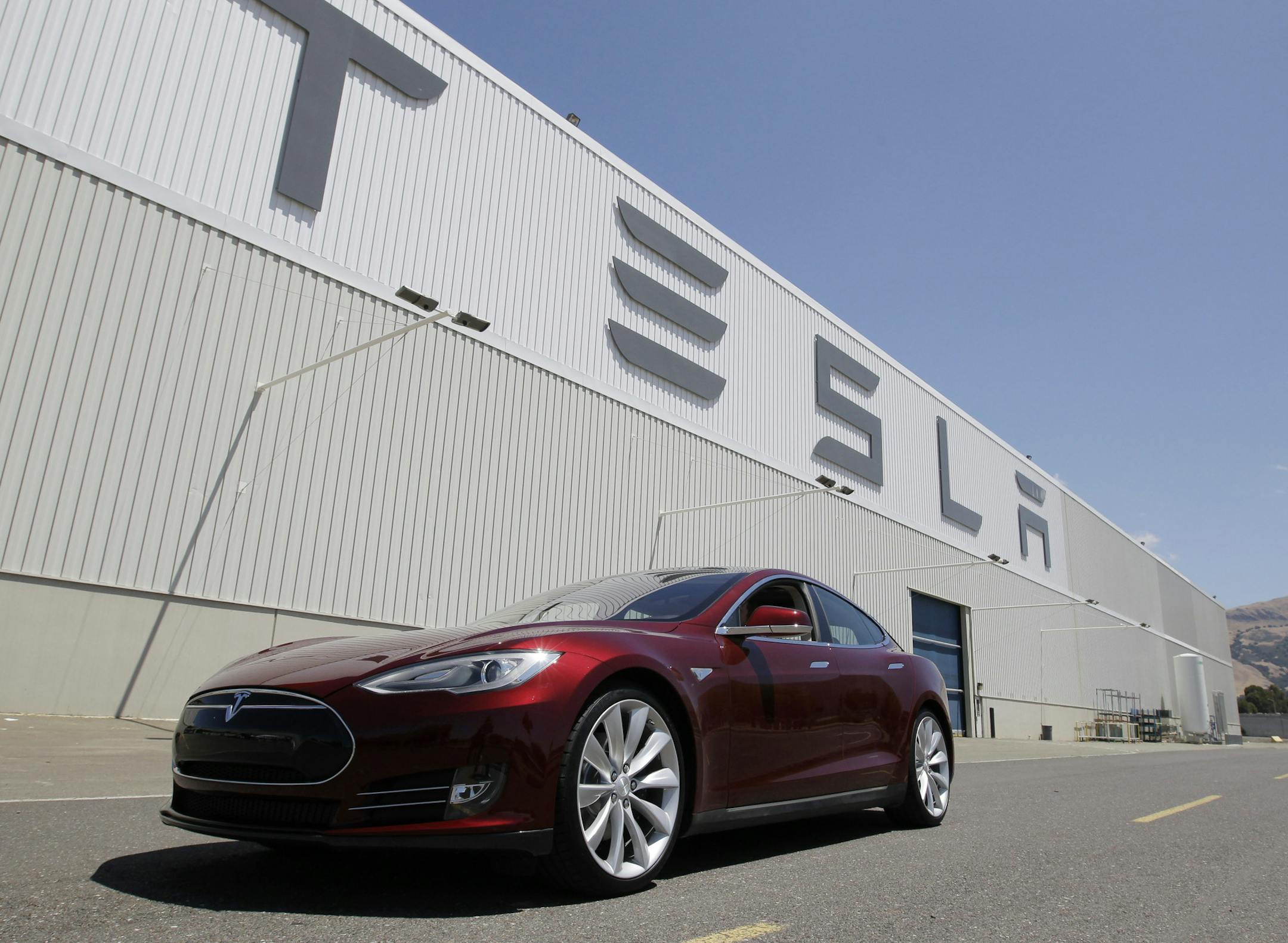 FILE - This June 22, 2012 file photo shows a Tesla Model S outside the Tesla factory in Fremont, Calif. The Tesla Model S electric sedan is Consumer Reportsí top pick in this yearís automotive survey. (AP Photo/Paul Sakuma, File)