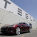 FILE - This June 22, 2012 file photo shows a Tesla Model S outside the Tesla factory in Fremont, Calif. The Tesla Model S electric sedan is Consumer R