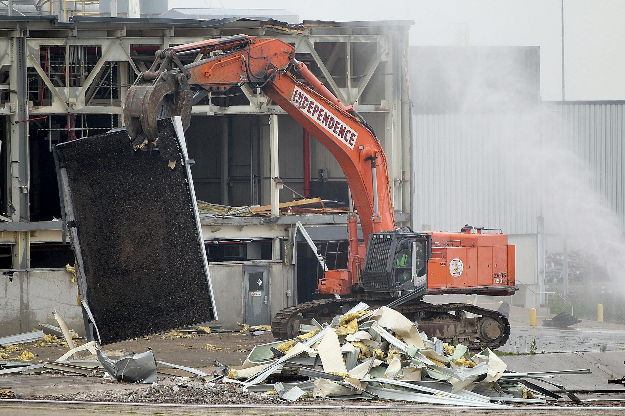Demolition crew took down the paint building of the 150-acre former Twin Cities Ford Assembly Plant, Monday, June 10, 2013 in St. Paul, MN. The Ford company has played an important role in St. Paul for nearly 90 years. (ELIZABETH FLORES/STAR TRIBUNE) ELIZABETH FLORES � eflores@startribune.com