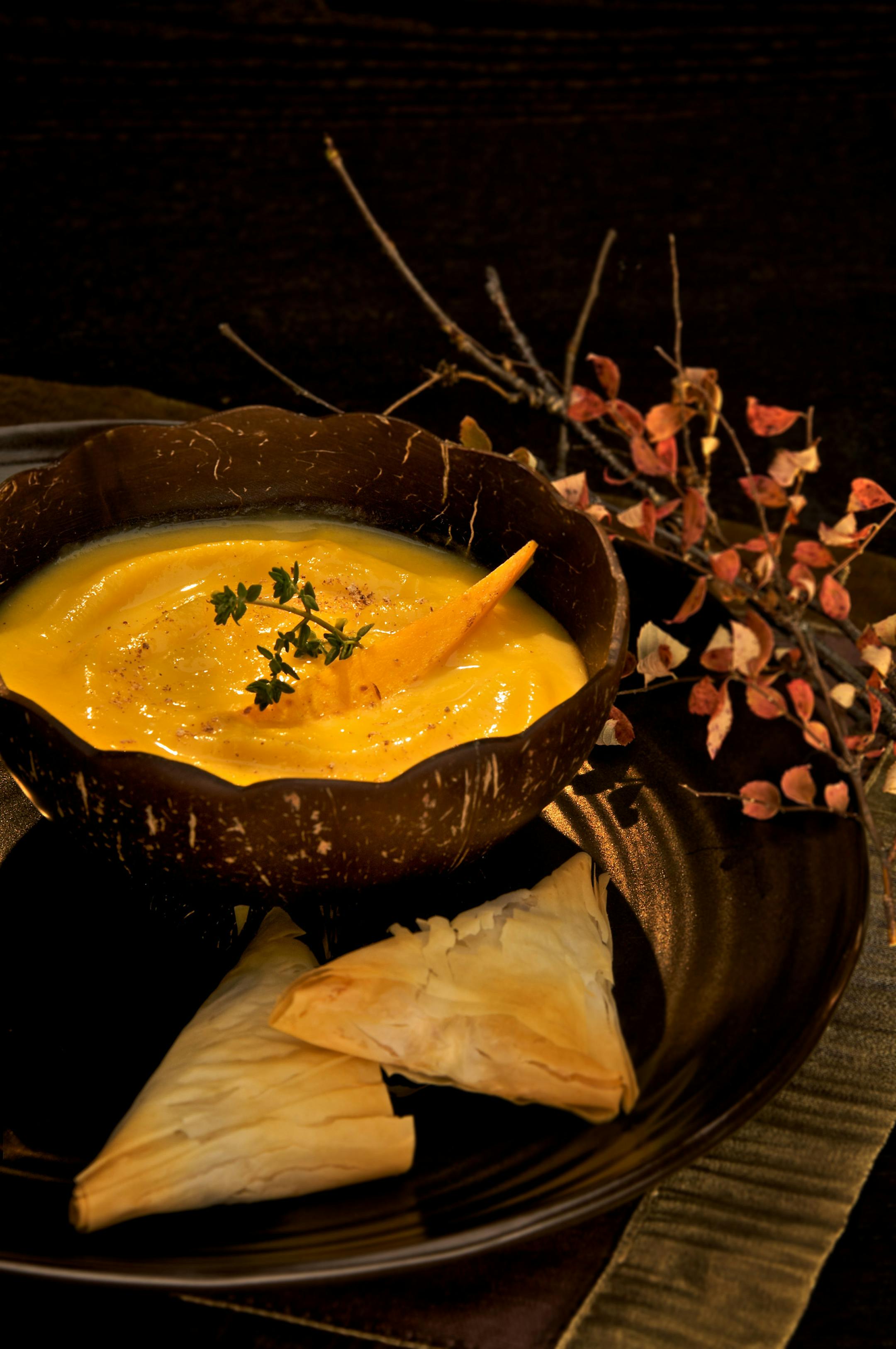 Squash soup and phyllo triangles of leek, goat cheese and sun-dried tomatoes start off this fall meal.