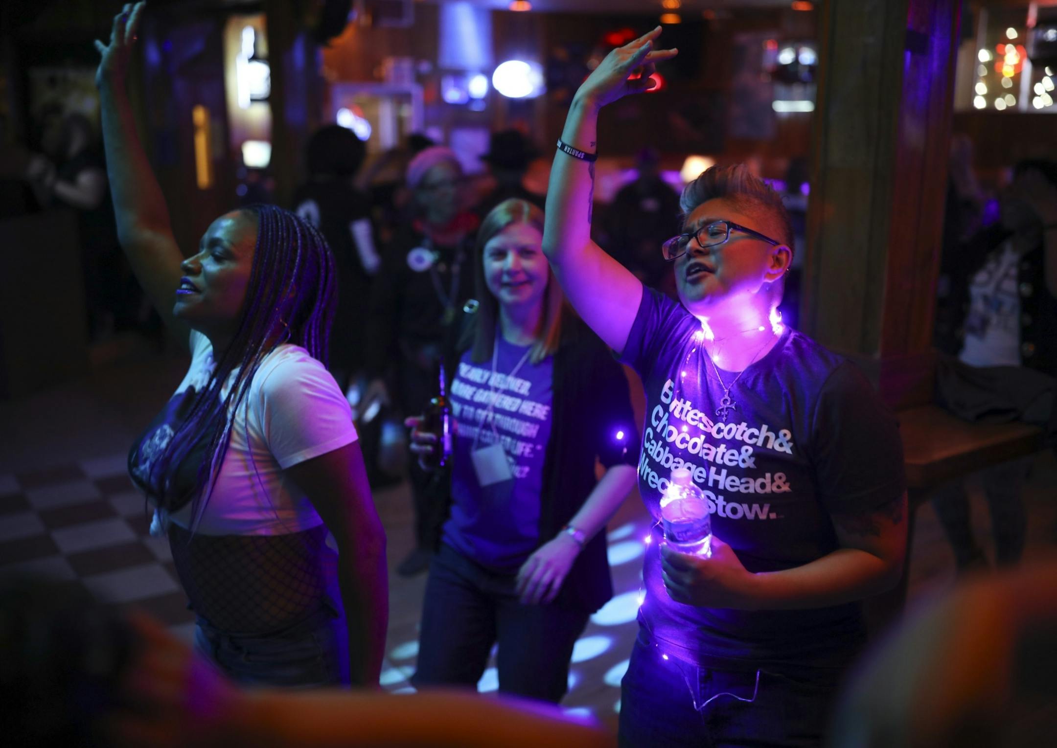 Angela Lesaca of Los Angeles, right, danced at the "Free Urself Dance Party" Wednesday night at Lee's Liquor Lounge.