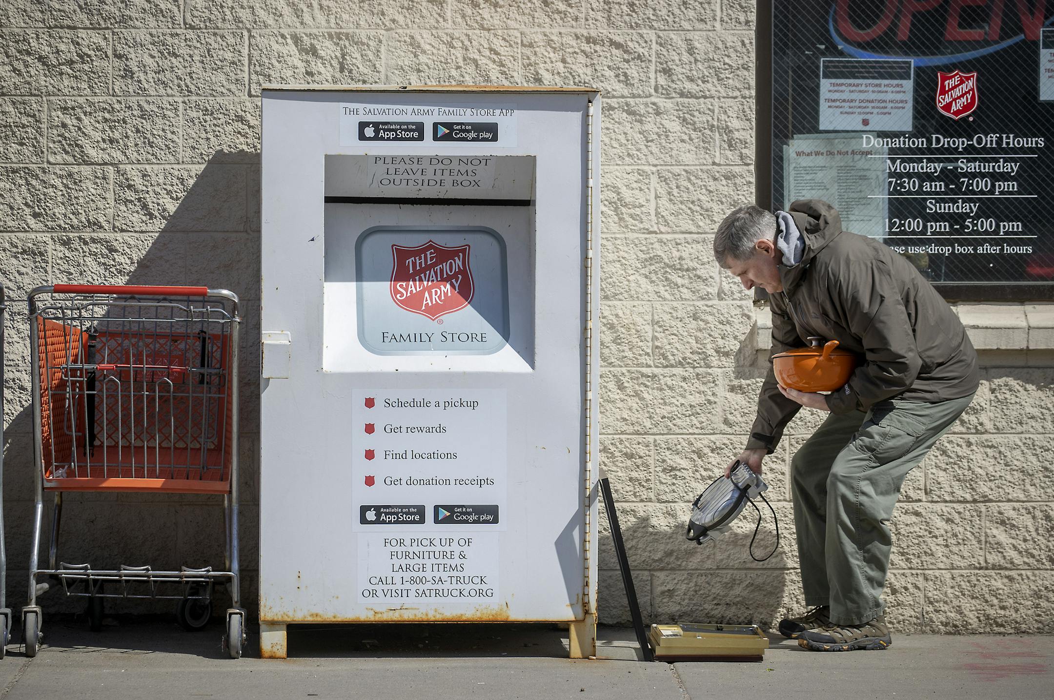 John Greer unloaded items from his car Wednesday to the Salvation Army donation center in Minneapolis' North Loop.