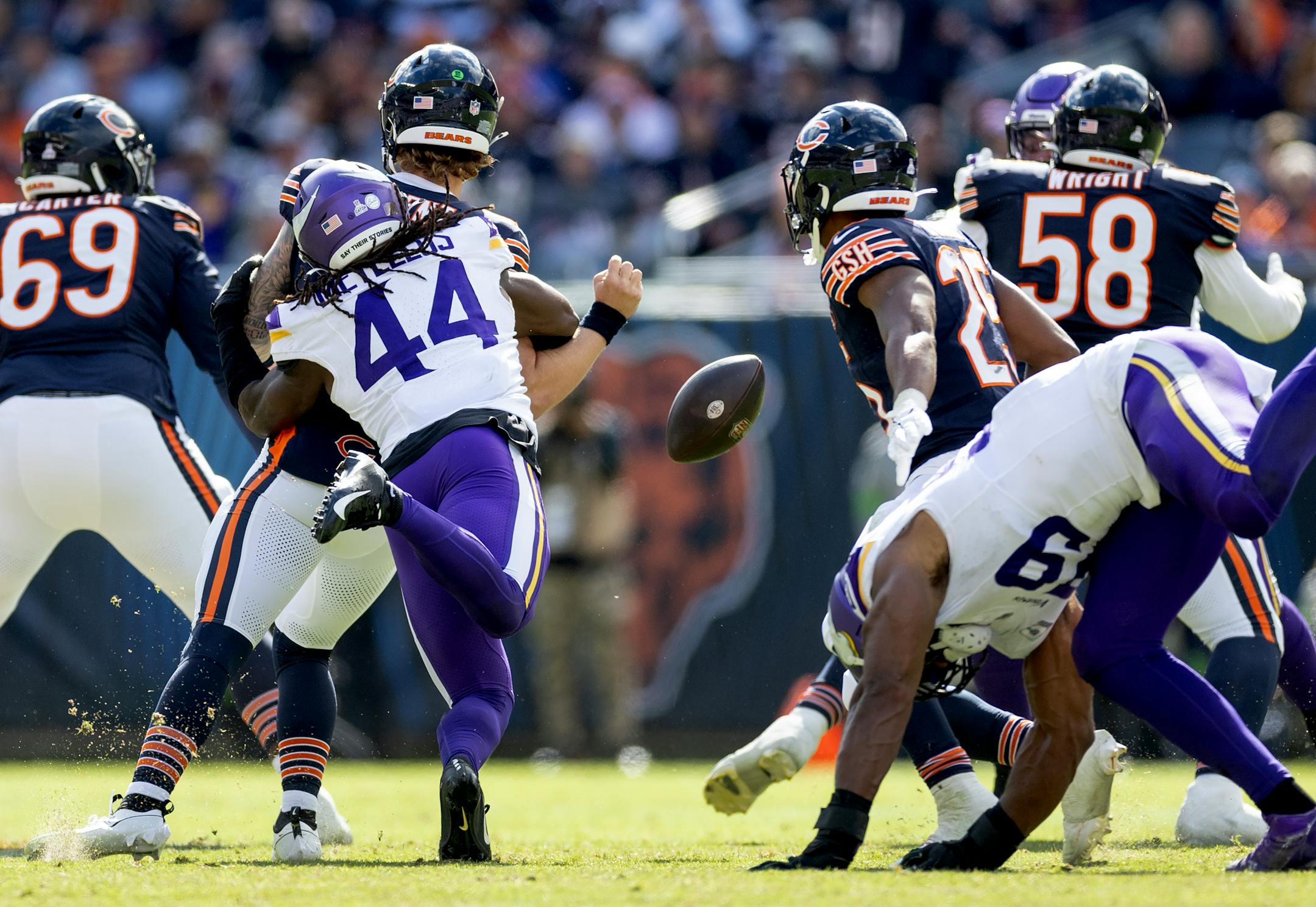 Chicago Bears quarterback Tyson Bagent (17) is stripped by Minnesota Vikings linebacker Josh Metellus (44) in the third quarter.