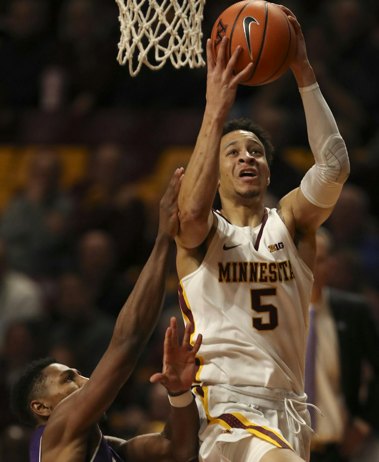 Minnesota Gophers guard Amir Coffey (5) made a first half shot over Northwestern guard Anthony Gaines (11). ] JEFF WHEELER &#xef; jeff.wheeler@startribune.com The beleaguered University of Minnesota men's basketball team faced the Northwestern Wildcats in a Big 10 conference game Tuesday night, January23, 2018 at Williams Arena in Minneapolis.