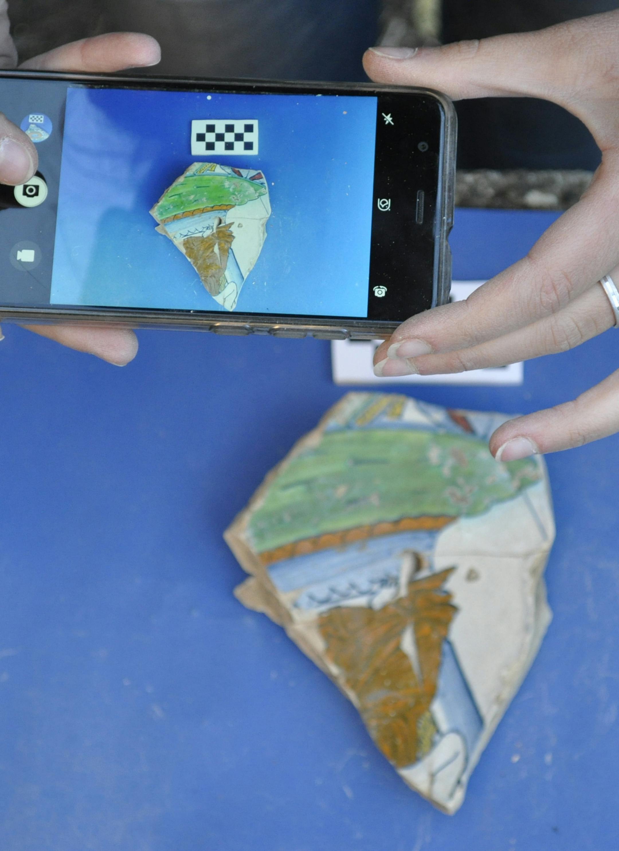 **EMBARGO: No electronic distribution, Web posting or street sales before 3:01 a.m. ET Tuesday, Nov. 24, 2020. No exceptions for any reasons. EMBARGO set by source.** In an undated photo from MPPALab - University of Pisa, photographing a piece of pottery. A project, called ArchAIDE, will allow archaeologists to photograph a piece of pottery in the field and have it identified by convolutional neural networks. . (MAPPALab - University of Pisa via The New York Times) -- NO SALES; FOR EDITORIAL USE