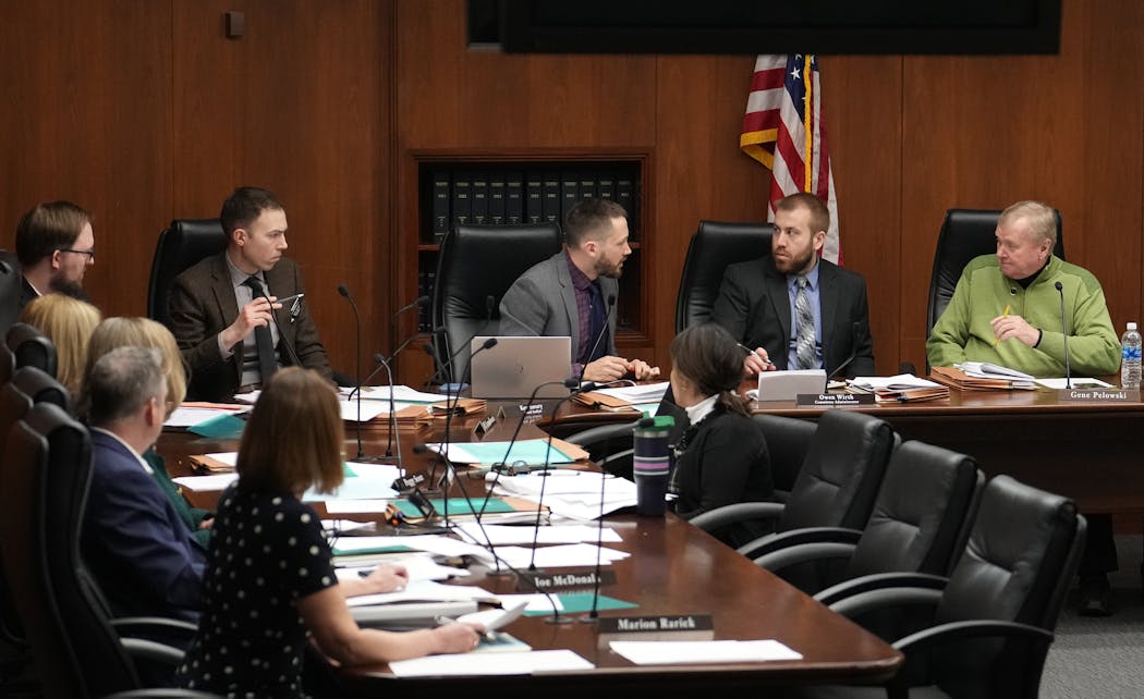 Committee Chair Rep. Gene Pelowski, DFL-Winona, right, presides over a House higher education committee meeting Thursday at the State Office Building in St. Paul. Pelowski said lawmakers have been visiting his office this week, urging him to find a way to help former foster children.