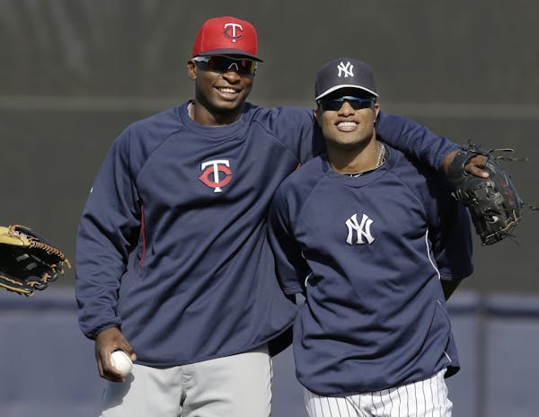 Sano with one of his baseball heroes, Robinson Cano, during spring training 2013. Cano was with the Yankees at the time and now plays for Seattle.
