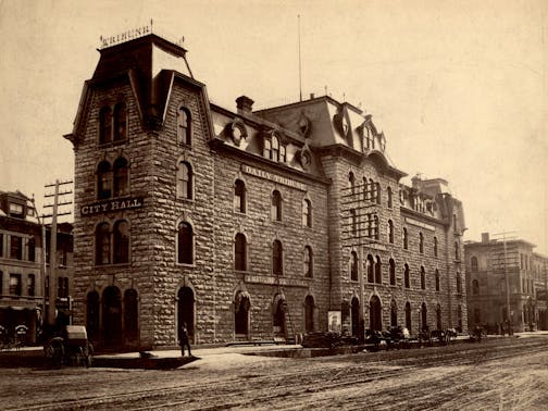 A brick building photographed in the 1880s shows where the Tribune was once located.