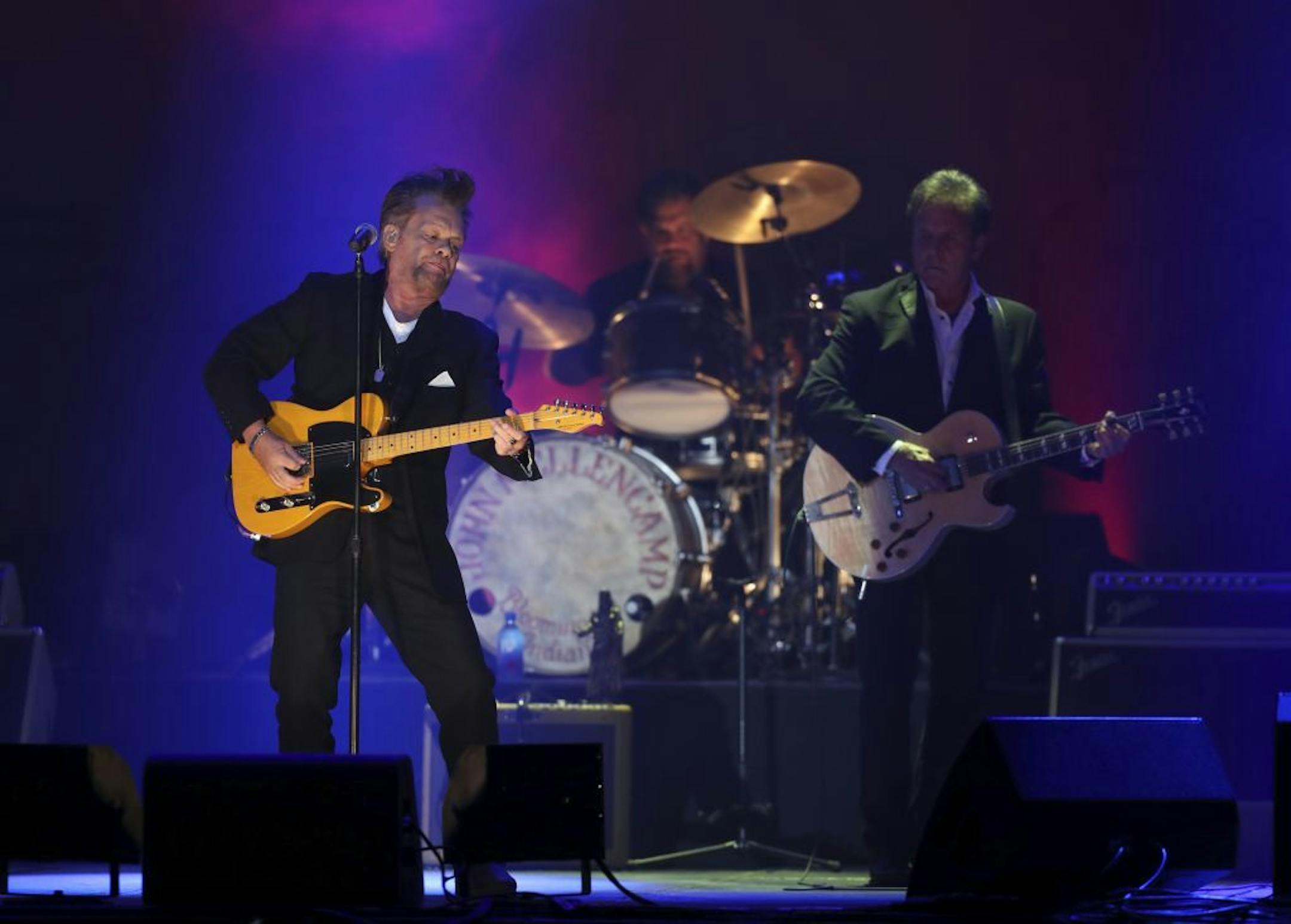 John Mellencamp with his band early in his State Fair Grandstand set Tuesday night.