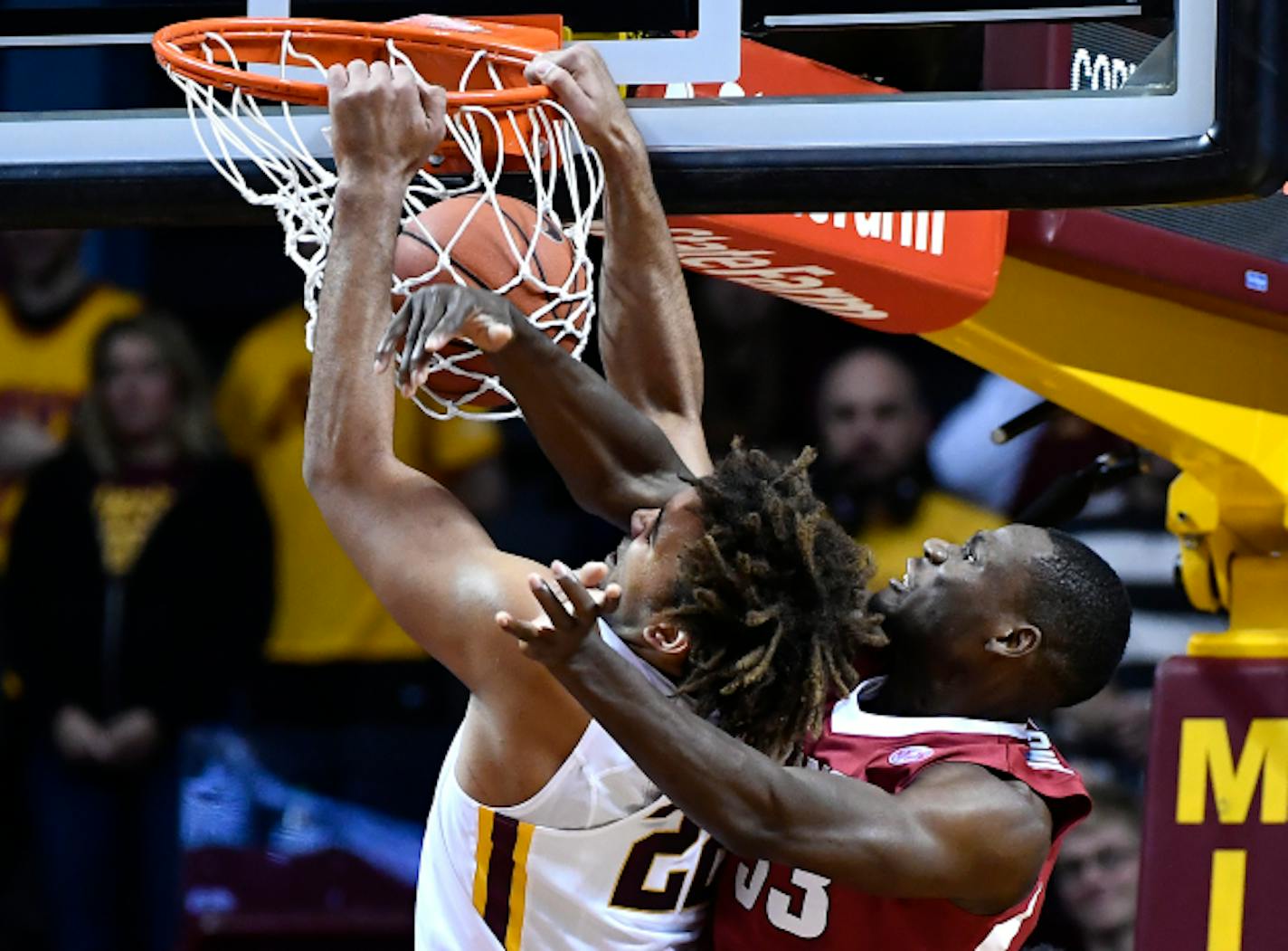 Minnesota's Reggie Lynch (22) dunks despite the defensive effort by Arkansas forward Moses Kingsley (33) in the first half on Tuesday, Nov. 22, 2016, at Williams Arena in Minneapolis. Minnesota won, 85-71. (Aaron Lavinsky/Minneapolis Star Tribune/TNS) ORG XMIT: 1193612