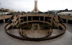 FILE - An empty view of the landmark martyrs monument which is seen empty after orders of home confinement to prevent the spread of coronavirus, in Al